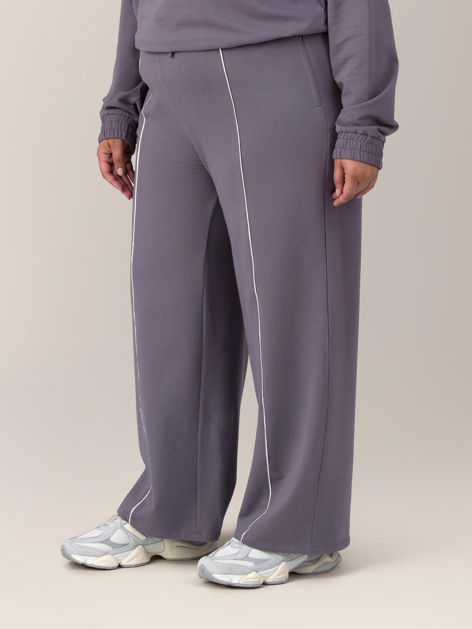 3/4 side view of model wearing the Mila High-Waisted Wide Leg Pant in Granite
