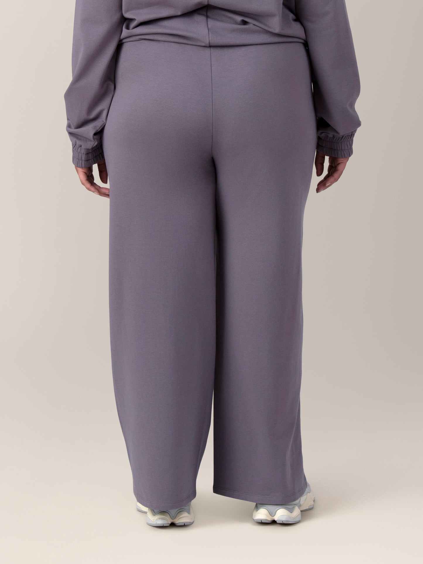 Back view of model wearing the Mila High-Waisted Wide Leg Pant in Granite