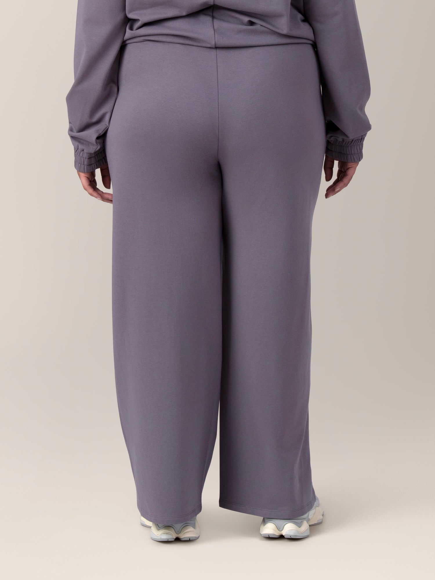 Back view of model wearing the Mila High-Waisted Wide Leg Pant in Granite