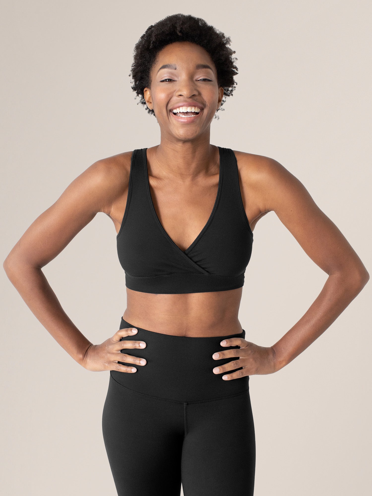 Model wearing the Organic Cotton Sleep & Nursing Bra in Black @model_info:Ayo is wearing a Small.