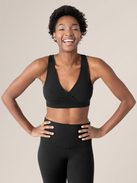 Model wearing the Organic Cotton Sleep & Nursing Bra in Black @model_info:Ayo is wearing a Small.