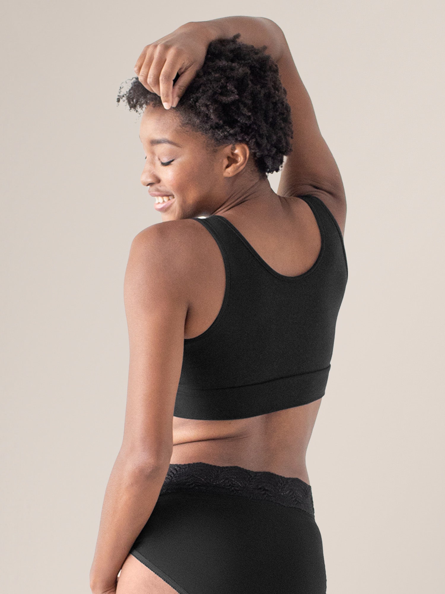 Back view of model wearing the Organic Cotton Sleep & Nursing Bra in Black