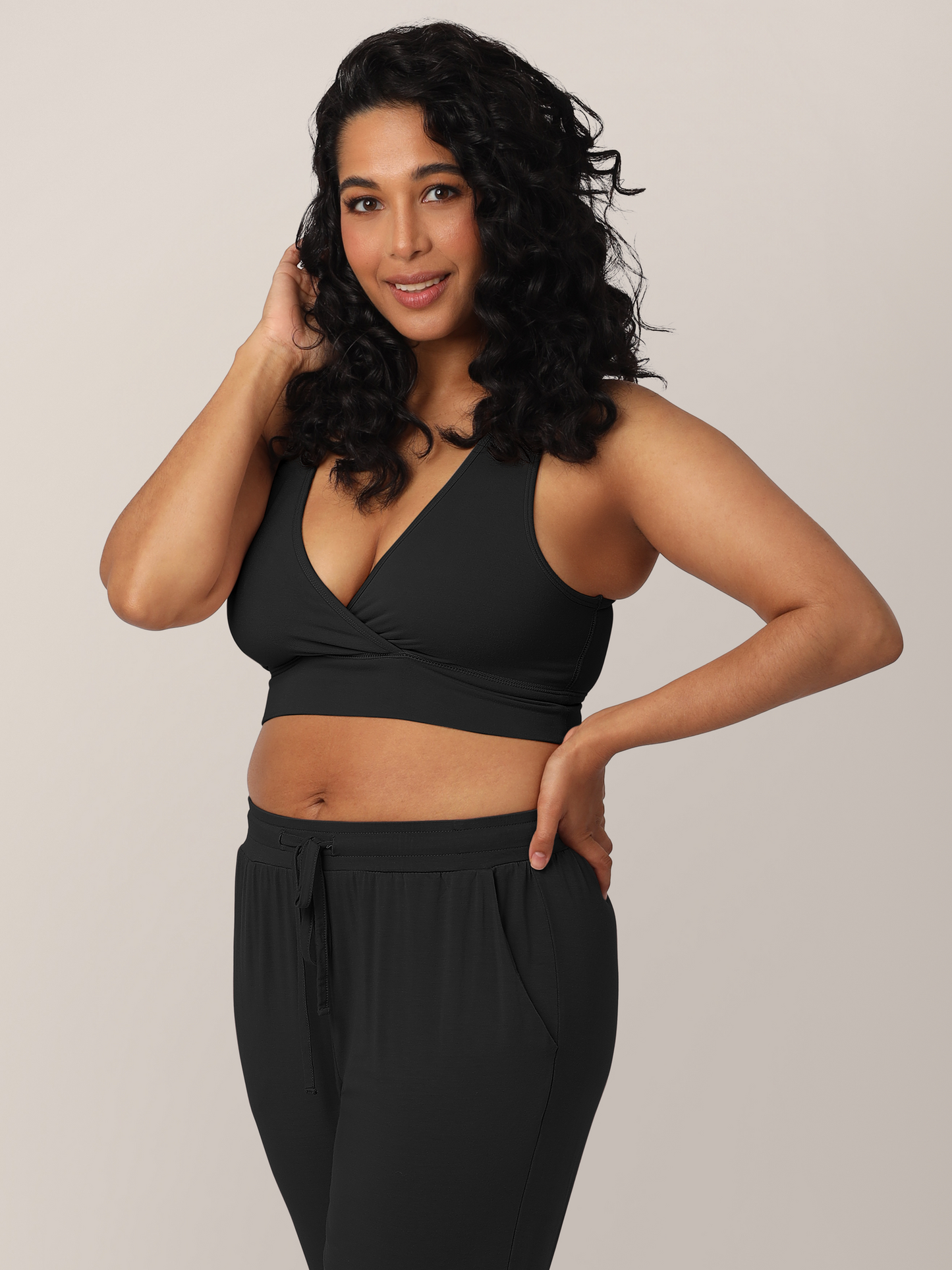 3/4 view of model wearing the French Terry Racerback Nursing & Sleep Bra in Black