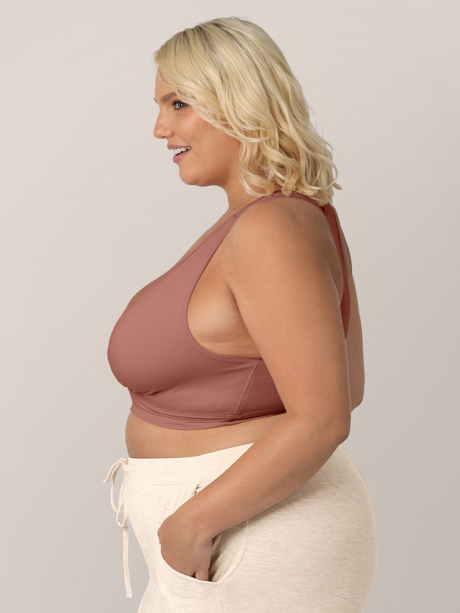 Side view of the model wearing the French Terry Racerback Nursing & Sleep Bra. 