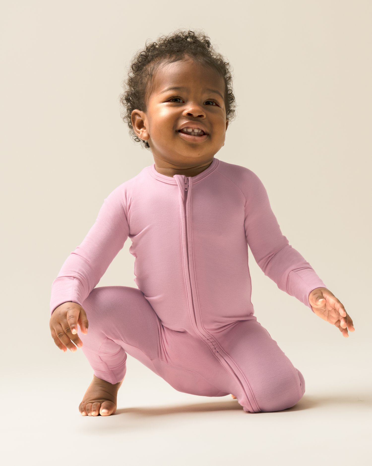 Child wearing Bamboo Baby Pajamas in Light Mauve on a plain background@model_info:Harper is wearing 3-6 months.