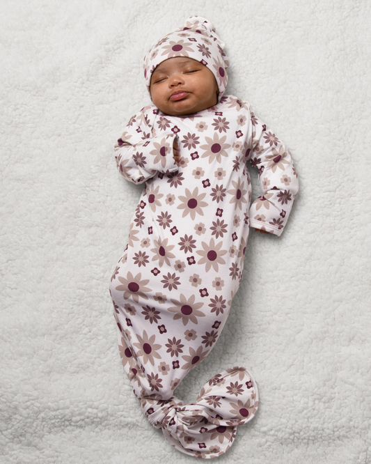 Baby wrapped in Bamboo Knotted Baby Gown in Twilight Floral on a light gray background@model_info:Luna is 6 weeks old.