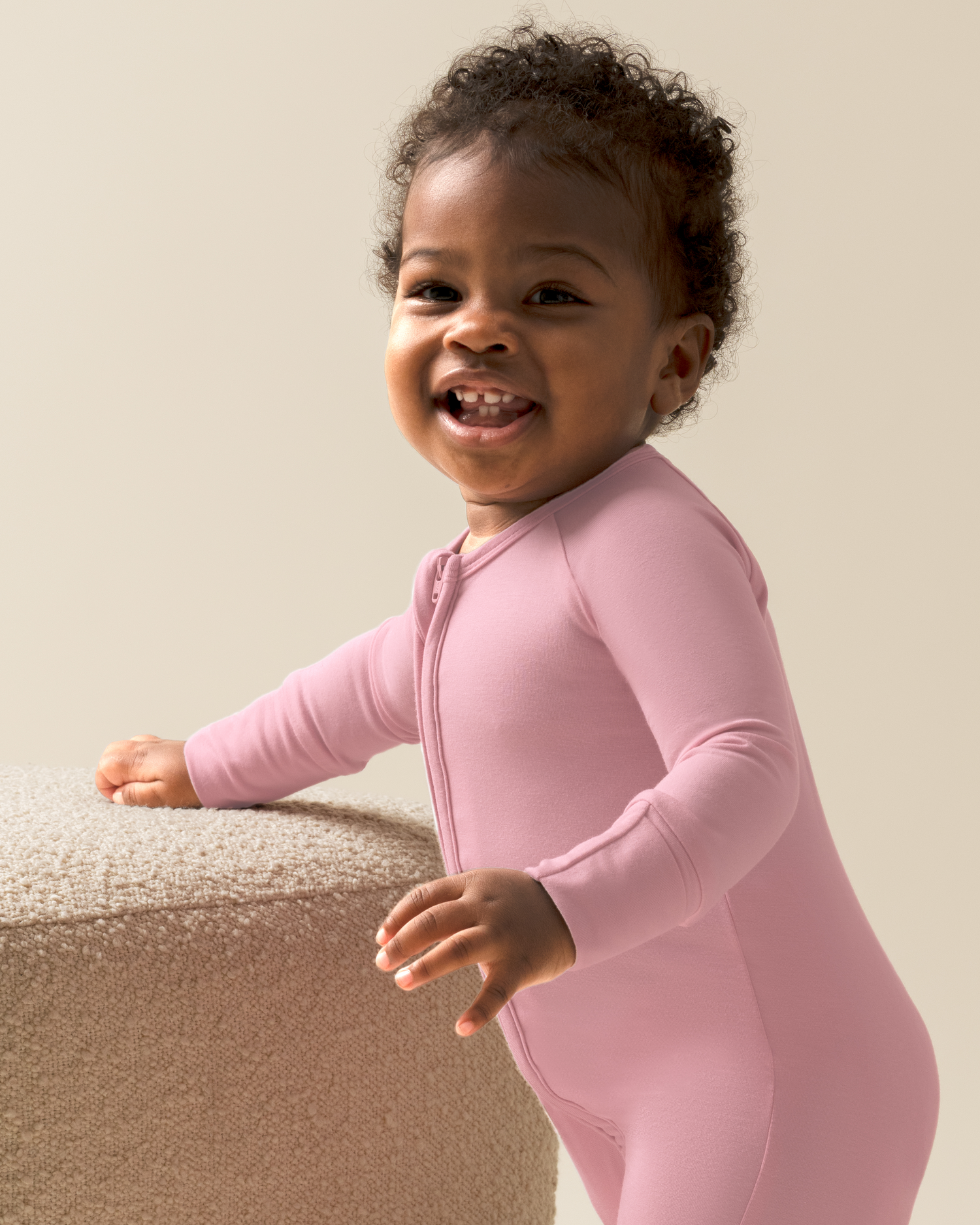 Child wearing Bamboo Baby Pajamas in Light Mauve against a neutral background