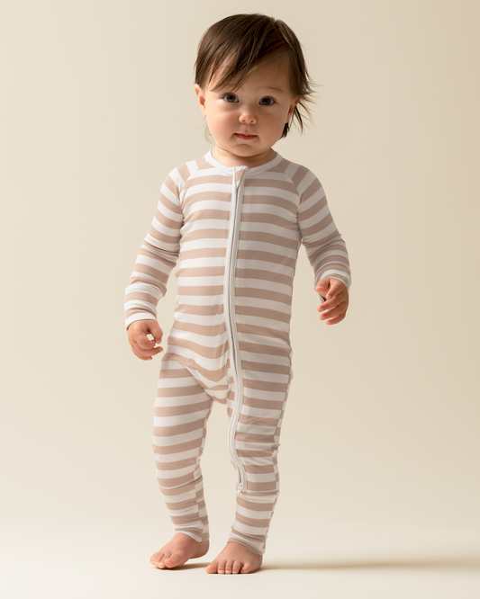 Baby wearing Bamboo Baby Pajamas in Fawn Stripe on a plain background@model_info:Mosey is wearing 3-6 months.