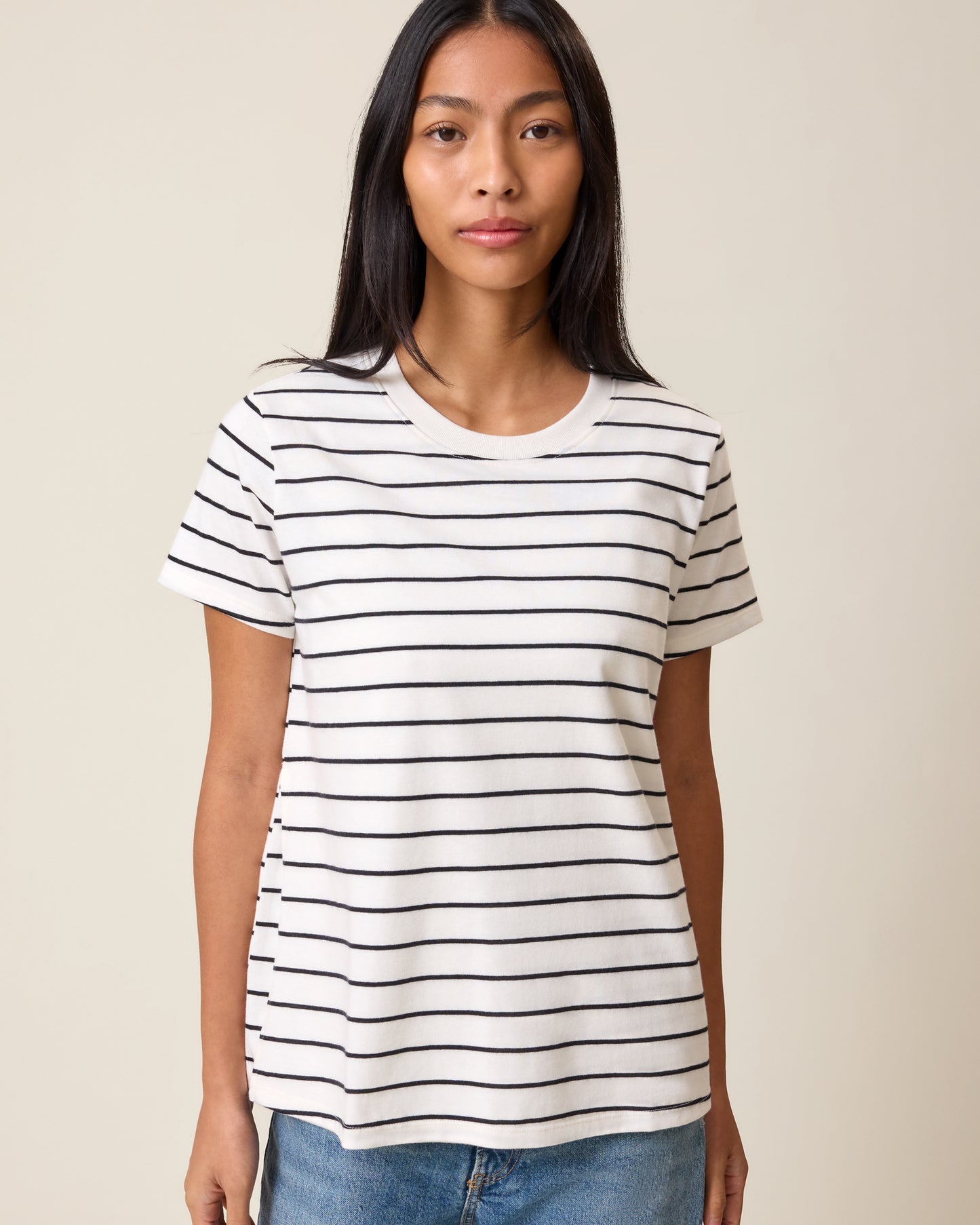 Front view of model wearing Classic Cotton Nursing T-shirt in White & Black Stripe on a neutral background