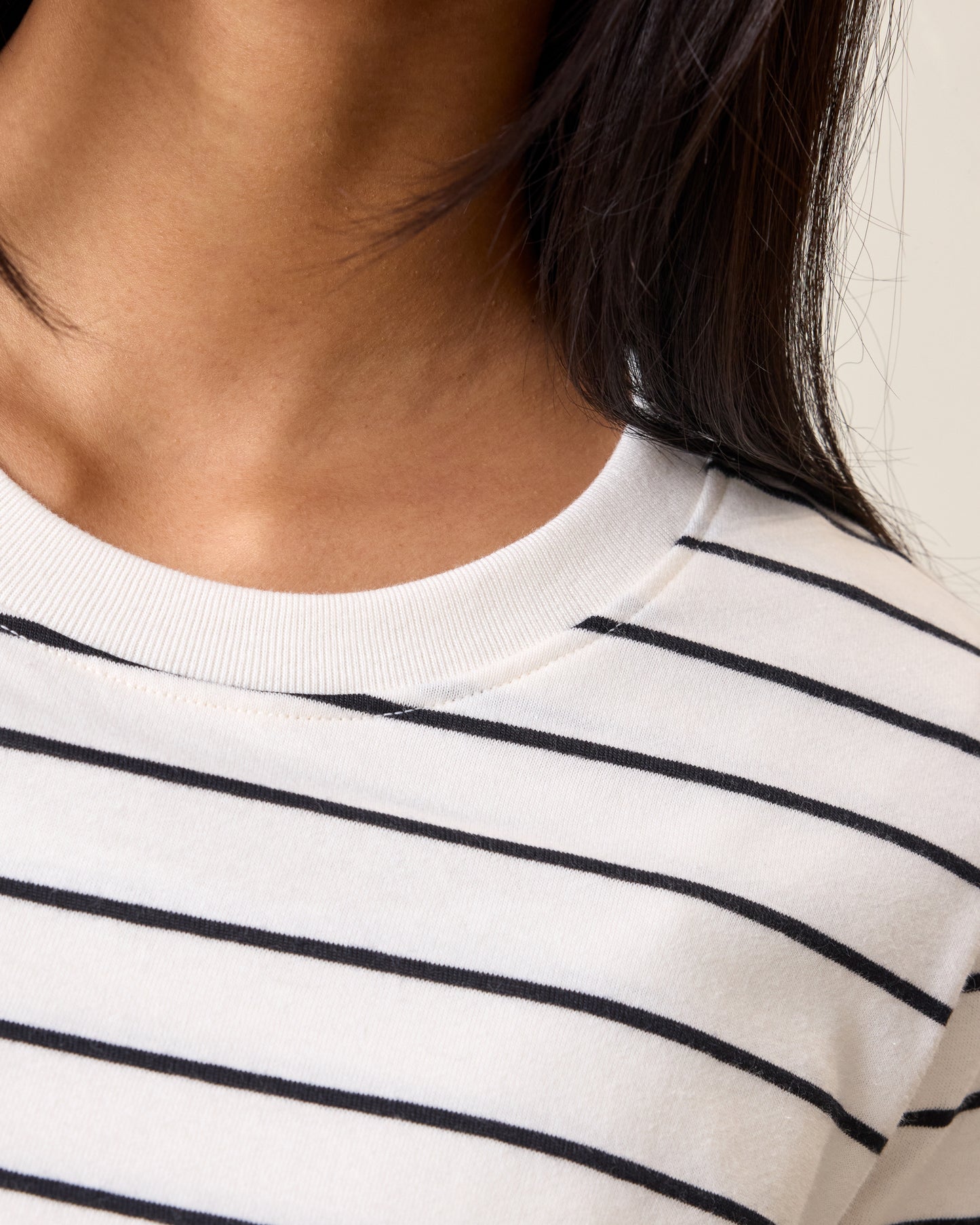 Close up of model wearing Classic Cotton Nursing T-shirt in White & Black Stripe showing the neckline detail