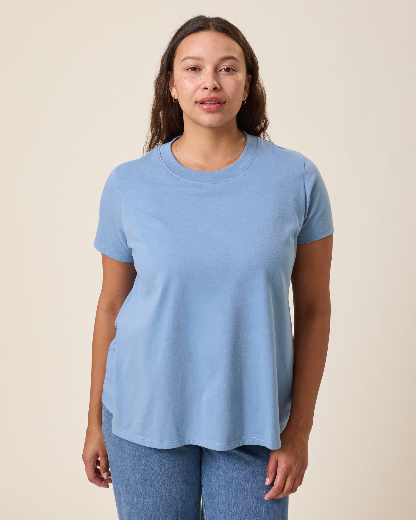 Front view of model wearing Classic Cotton Nursing T-shirt in Vintage Blue on a neutral background@model_info:Alana is wearing a Large.