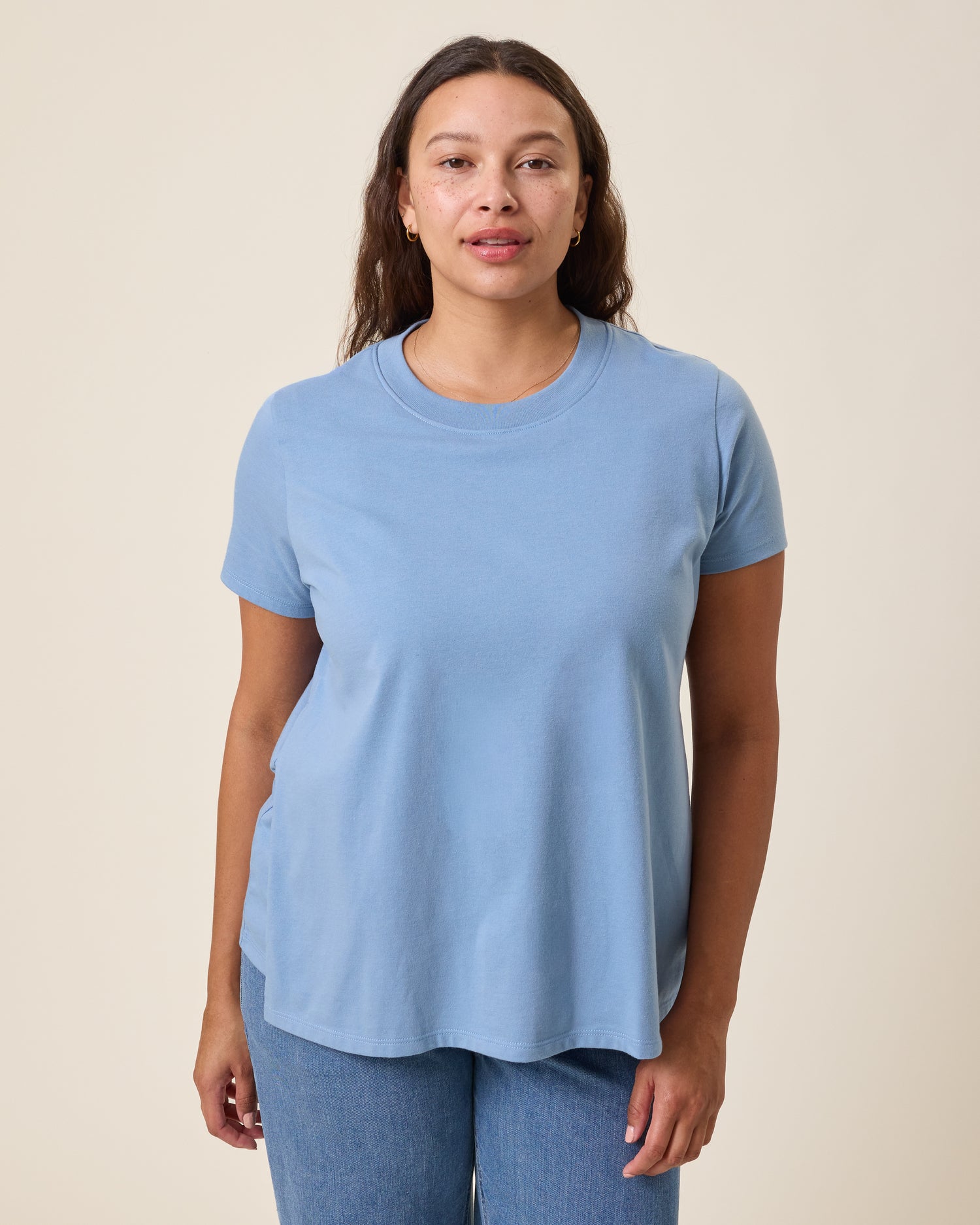 Front view of model wearing Classic Cotton Nursing T-shirt in Vintage Blue on a neutral background@model_info:Alana is wearing a Large.