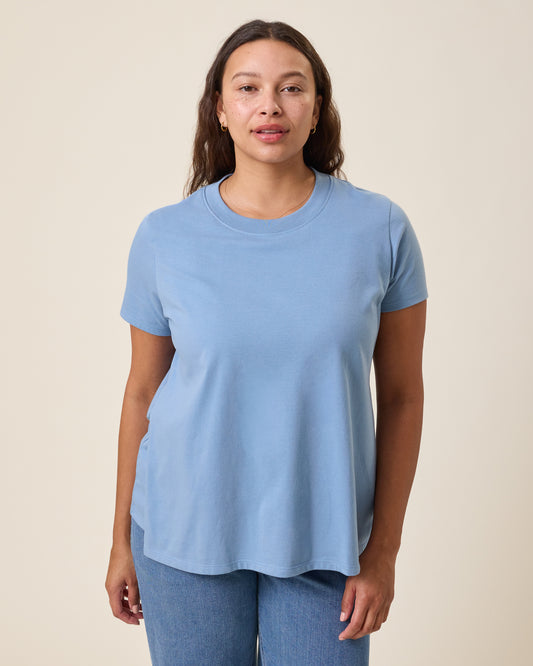 Front view of model wearing Classic Cotton Nursing T-shirt in Vintage Blue on a neutral background@model_info:Alana is wearing a Large.