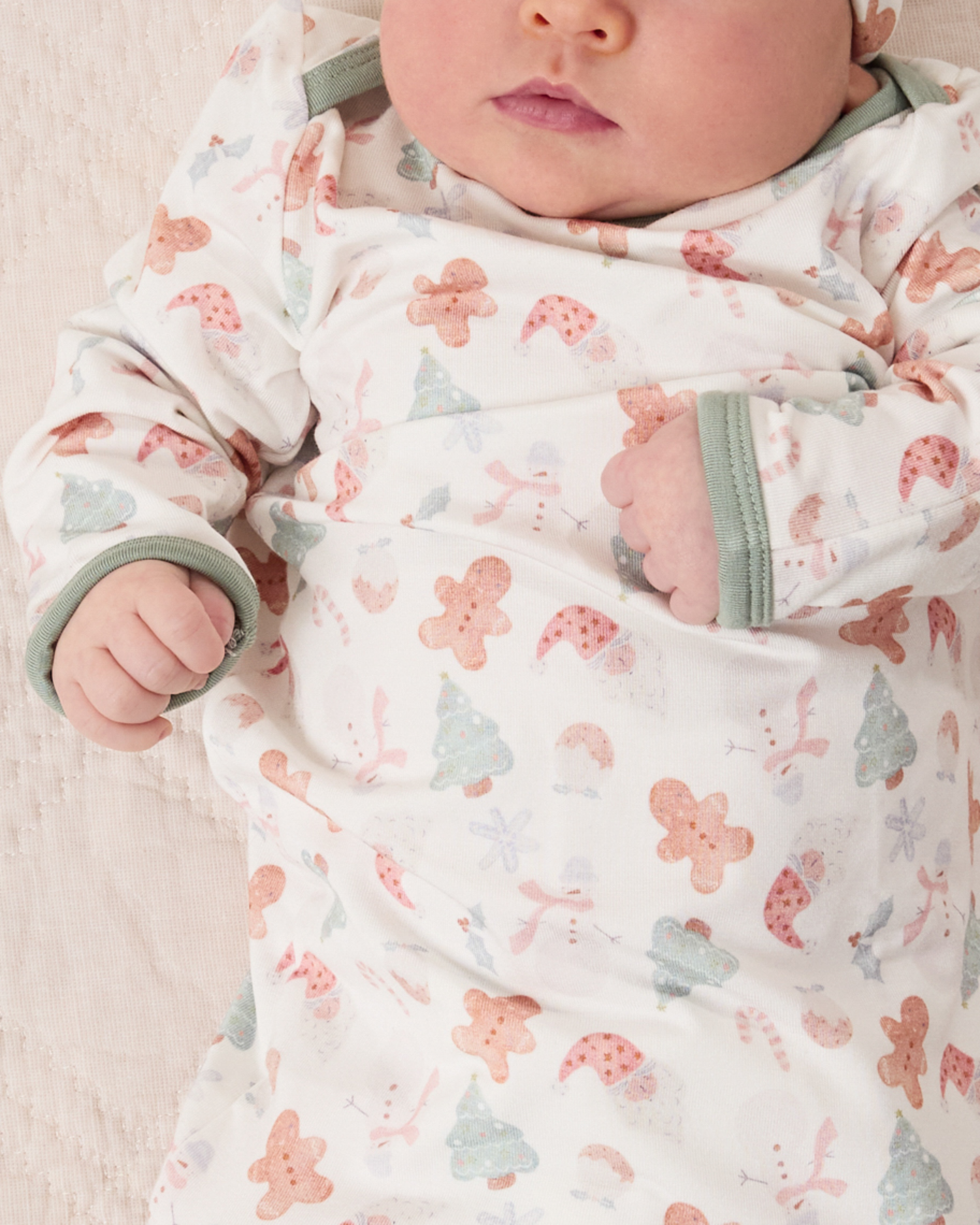 Baby wearing the Cozy Bamboo Baby Gown & Hat in Cozy Holiday pattern - gingerbread men, Christmas trees, candy canes, Santa, snowmen