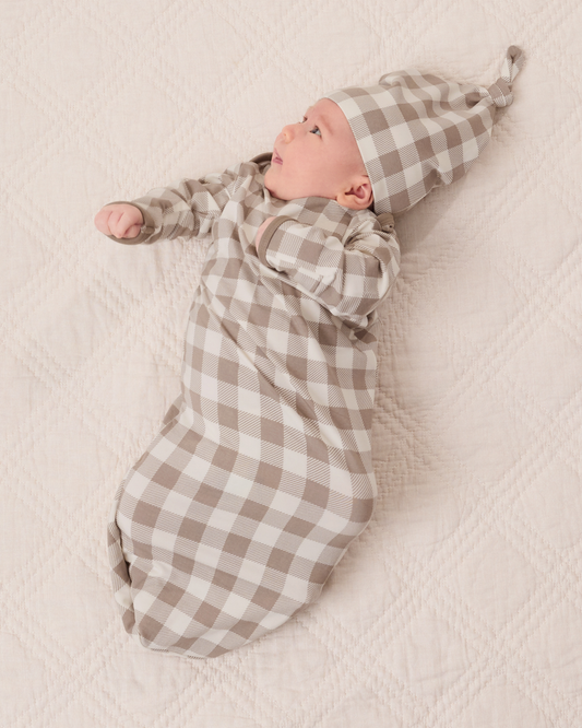 Baby wearing the Cozy Bamboo Baby Gown & Hat in Taupe Gingham checkered fabric@model_info:Liora is 5 weeks old.
