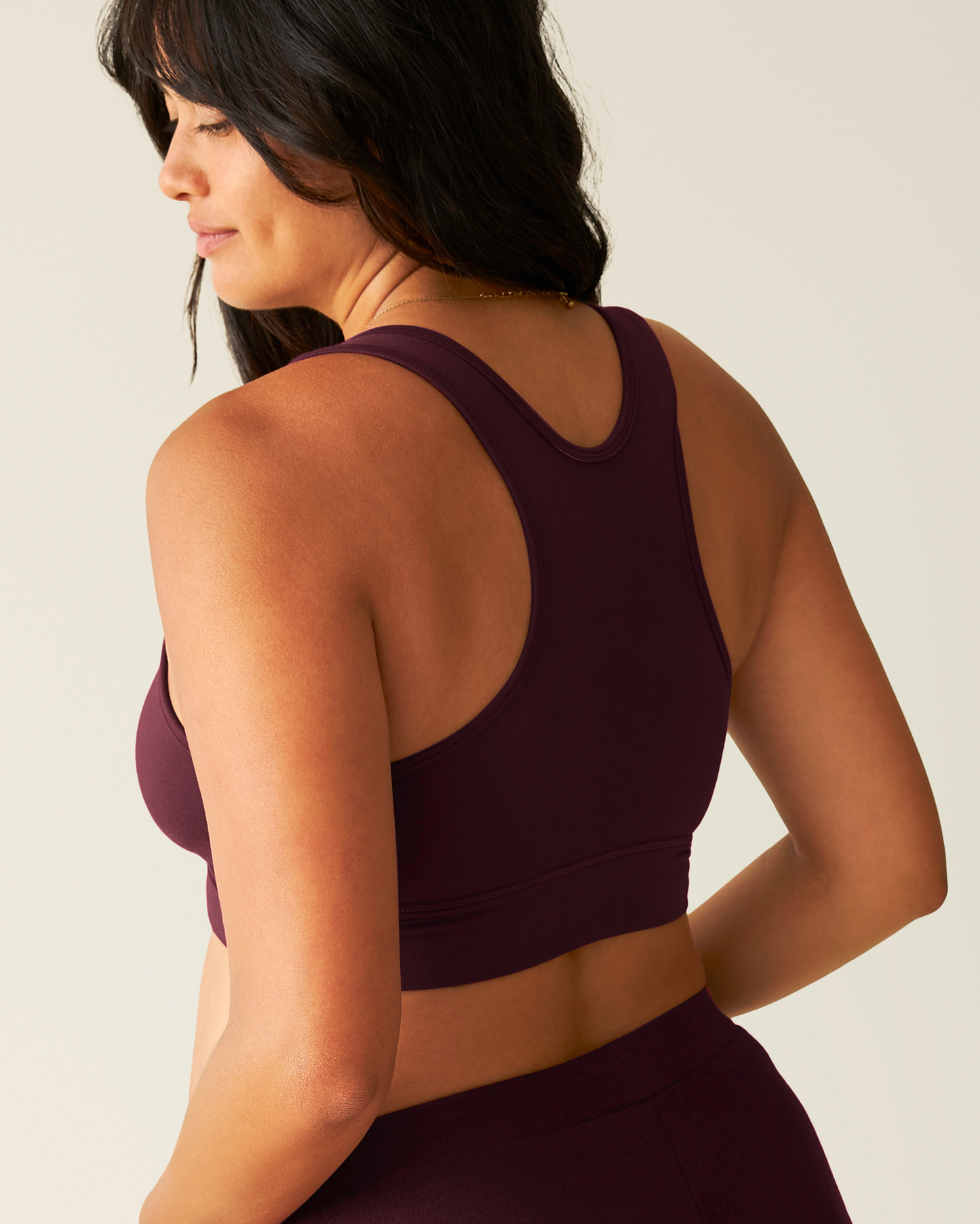 Back view of model wearing French Terry Racerback Nursing & Sleep Bra in Deep Burgundy