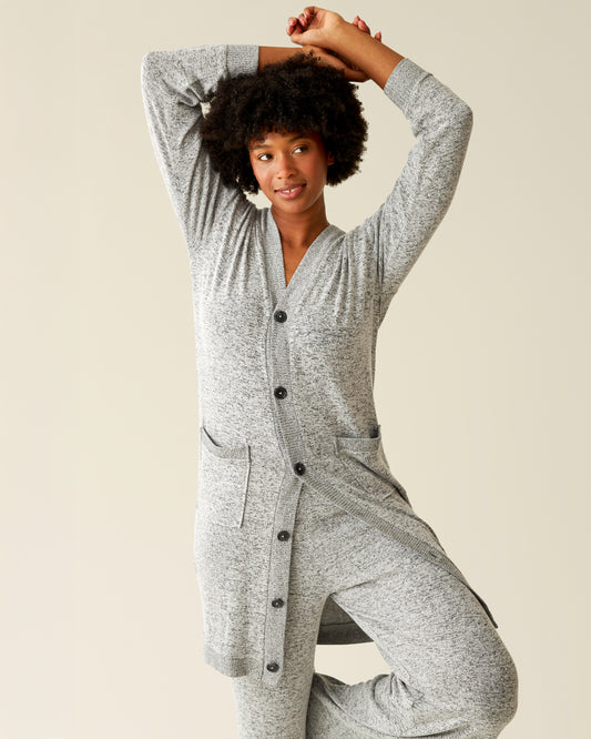 Front view of model with her arms up wearing CozyKnit Long Cardigan in Grey Heather@model_info:Kyra is 5'9" and wearing a Small.