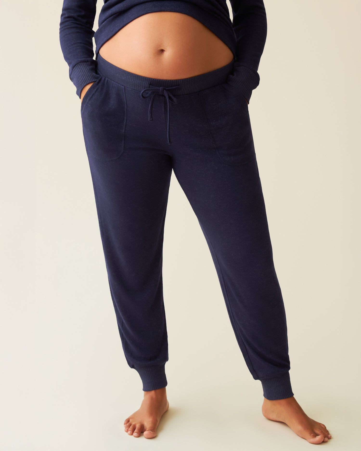 CozyKnit Nursing Pajama & Lounge Set in Navy worn by a pregnant model on a light beige background