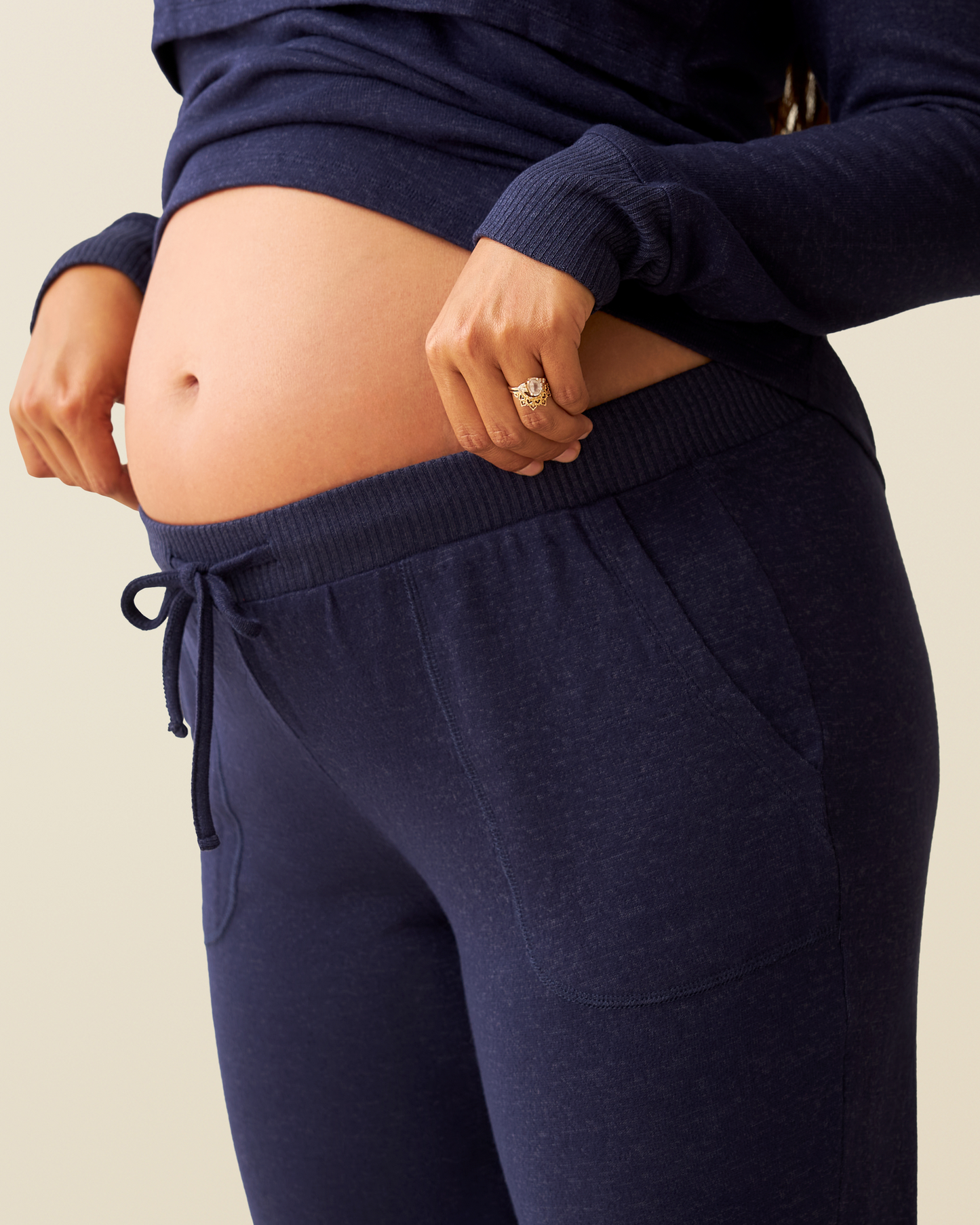 CozyKnit Nursing Pajama & Lounge Set in Navy pants worn by a pregnant model