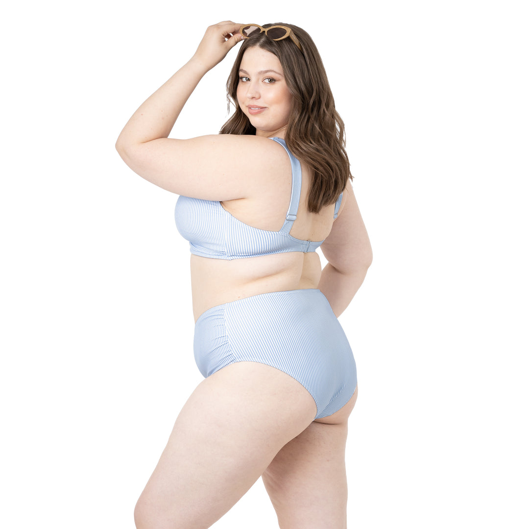 Side view of a model wearing the Crossover Maternity & Nursing Bikini Top
