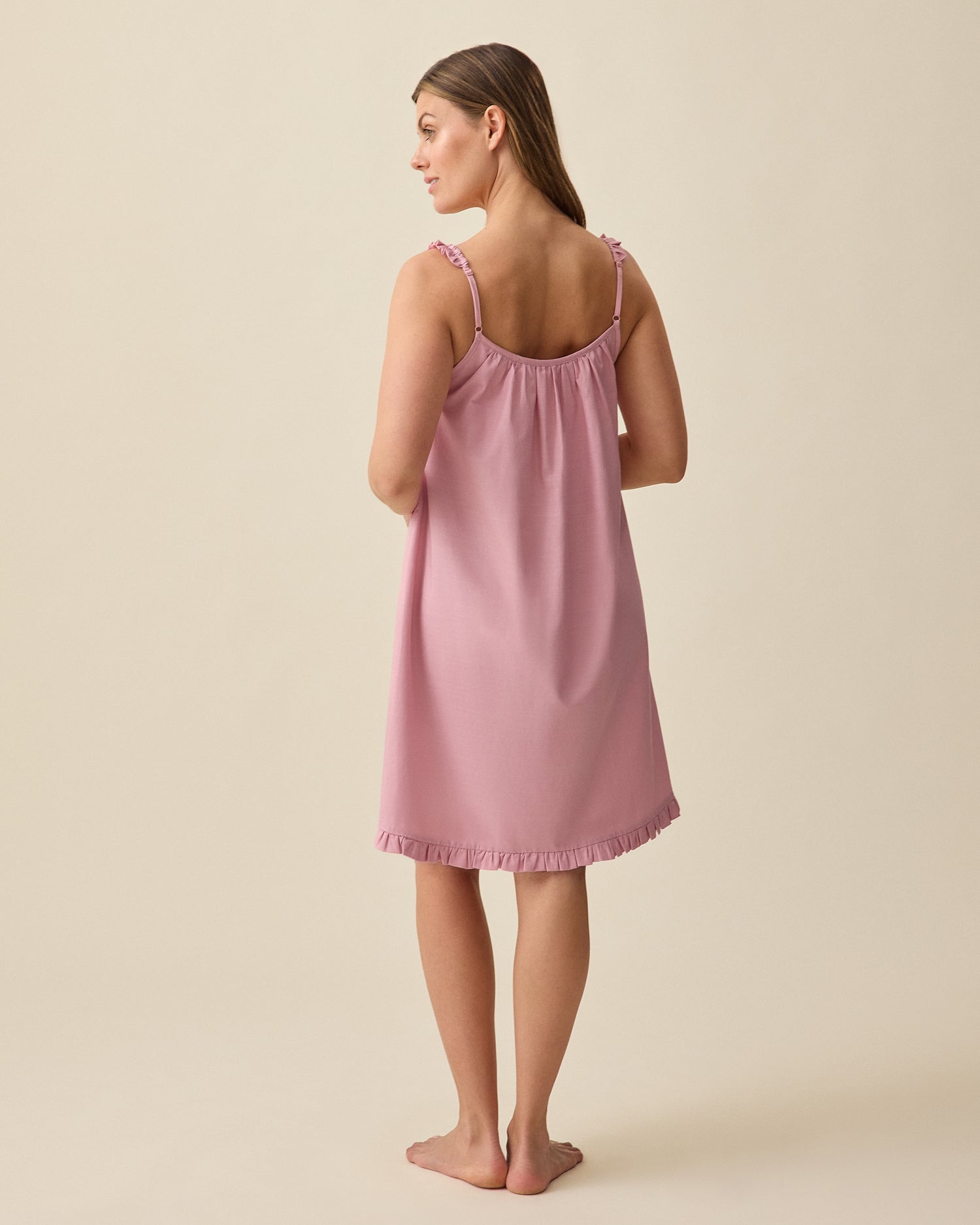 Model displaying back view of Dreamy Cotton Maternity & Nursing Nightgown in Light Mauve on a beige background