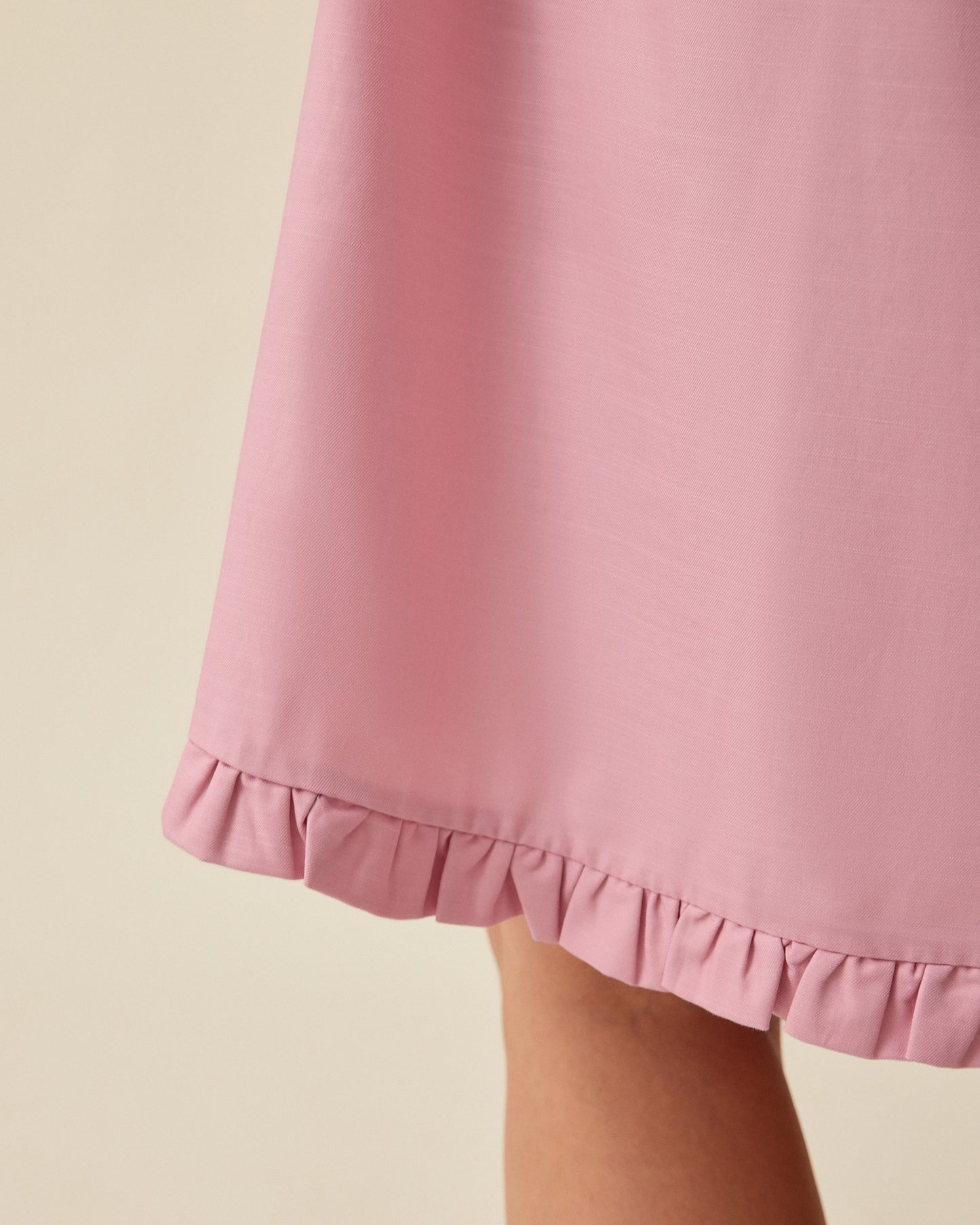 Close up of Dreamy Cotton Maternity & Nursing Nightgown in Light Mauve on a beige background