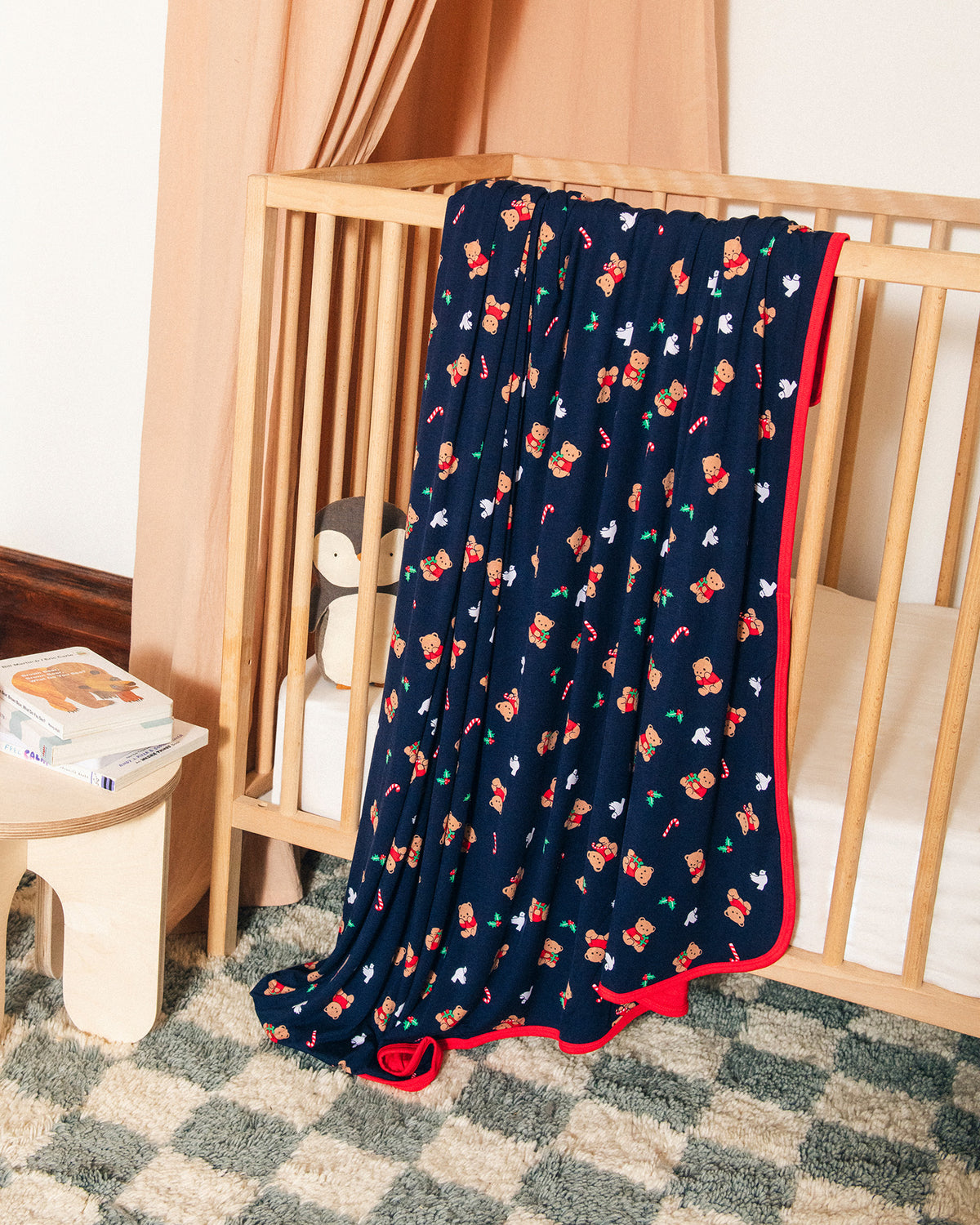 Nursery room with Bamboo Blanket in Bearing Gifts over the side of crib.