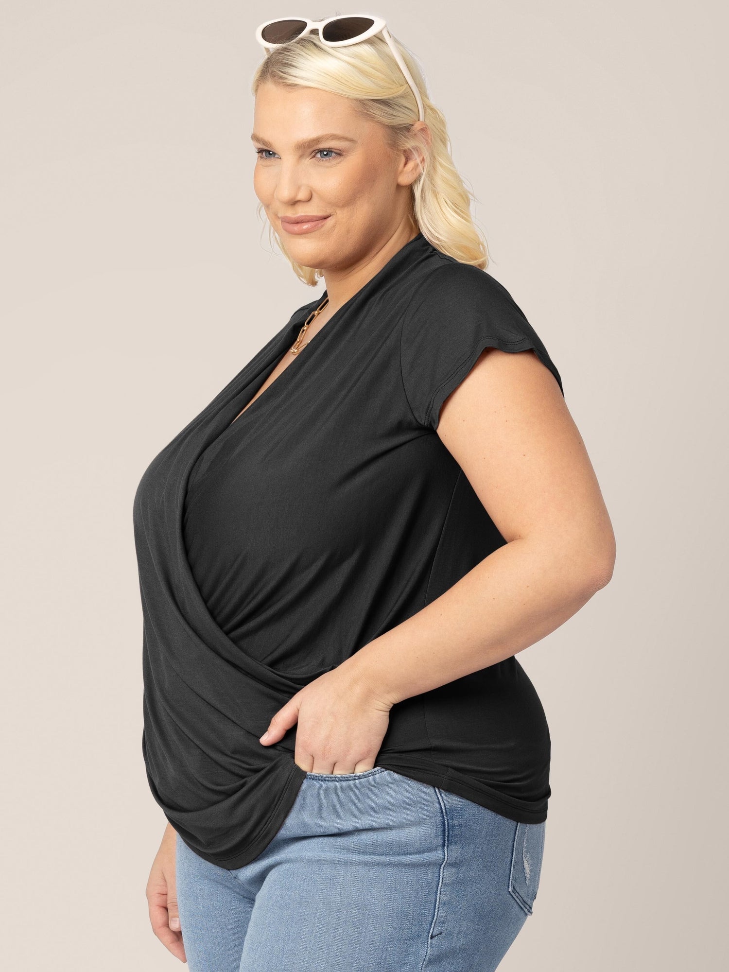 3/4 angle view of model wearing the Bamboo Draped Nursing Top in black 