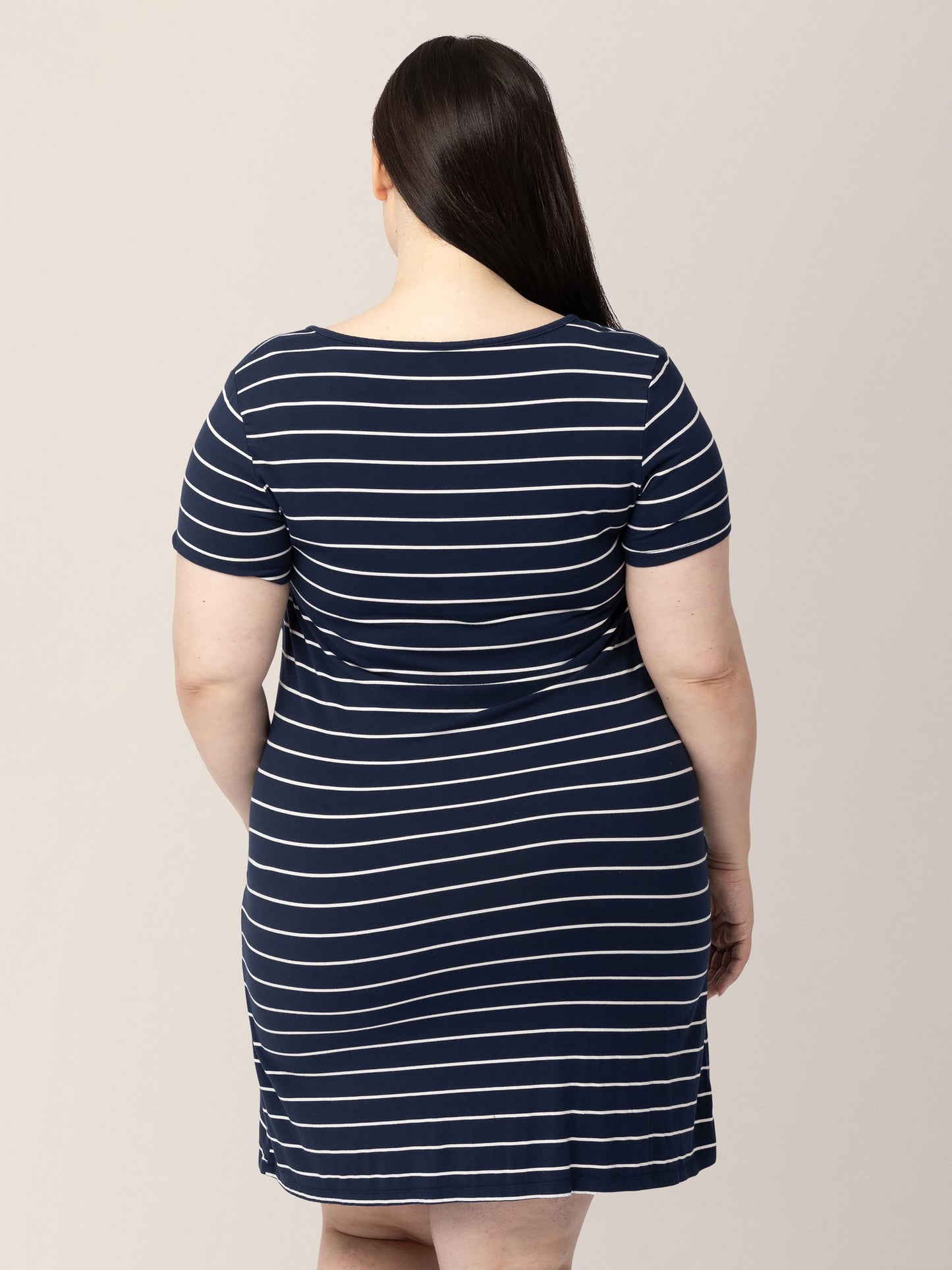 Back of a model wearing the Eleanora Bamboo Maternity & Nursing Dress in Navy Stripe