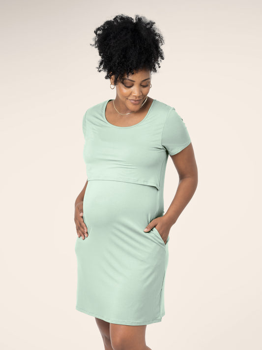 Front view of model wearing the Eleanora Bamboo Maternity & Nursing Dress in soft mint, with hand in pocket @model_info:Roxanne is 5'8" and wearing a Large.