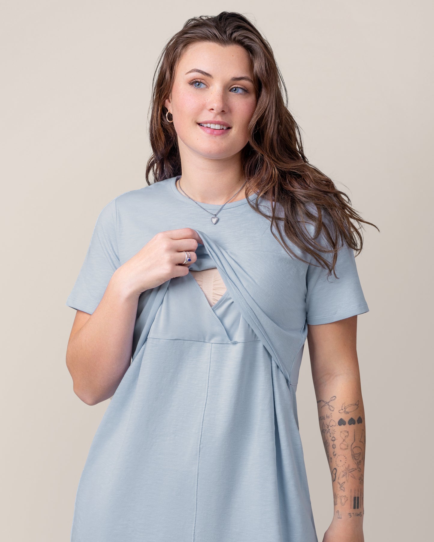 Front view of model wearing the Emmie Nursing T-shirt Dress in French Blue, showing the pull-up nursing access
