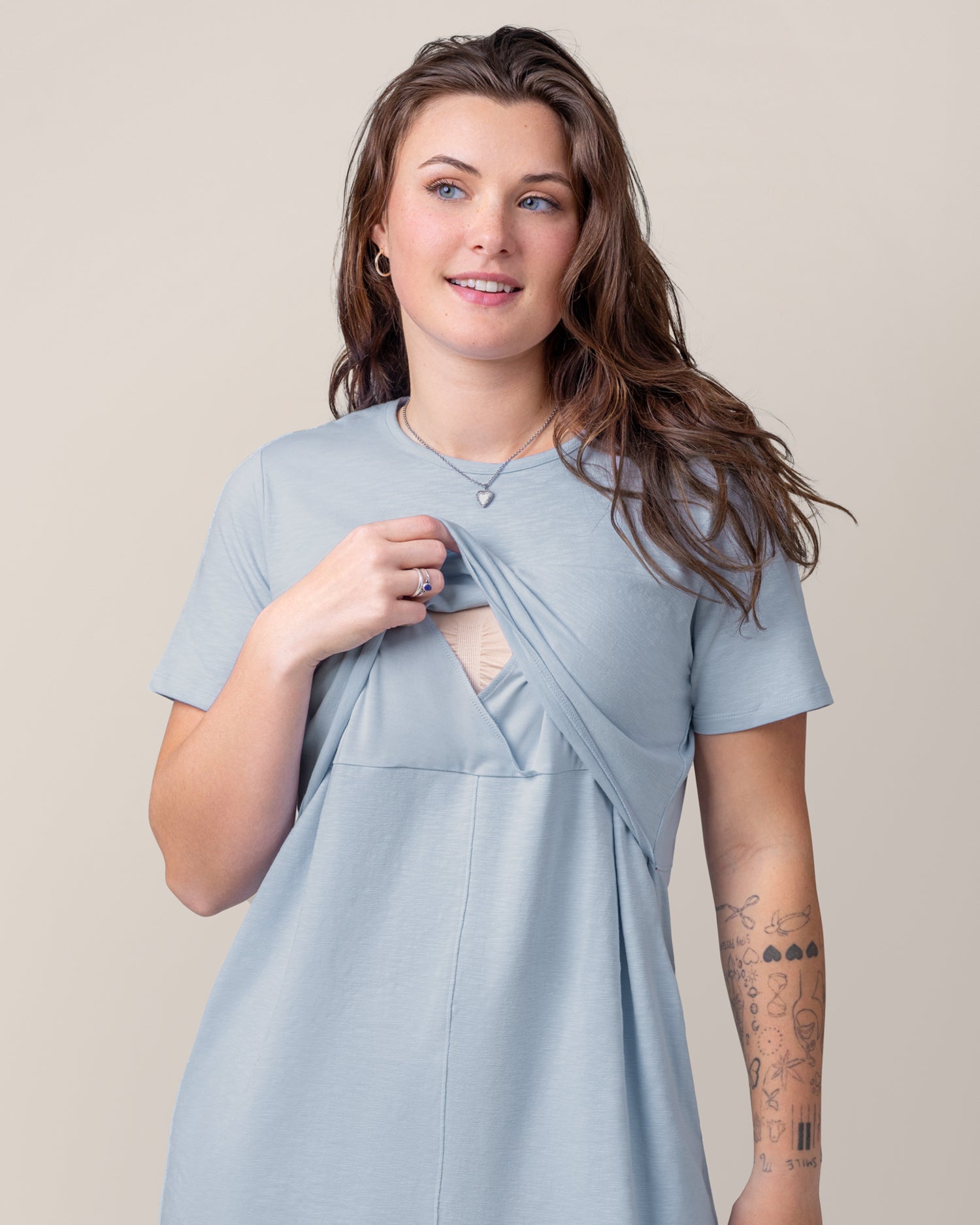 Front view of model wearing the Emmie Nursing T-shirt Dress in French Blue, showing the pull-up nursing access