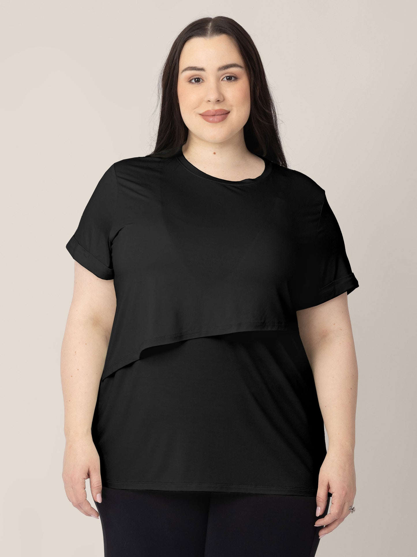 Front view of a model wearing the Everyday Asymmetrical Nursing T-shirt in Black.