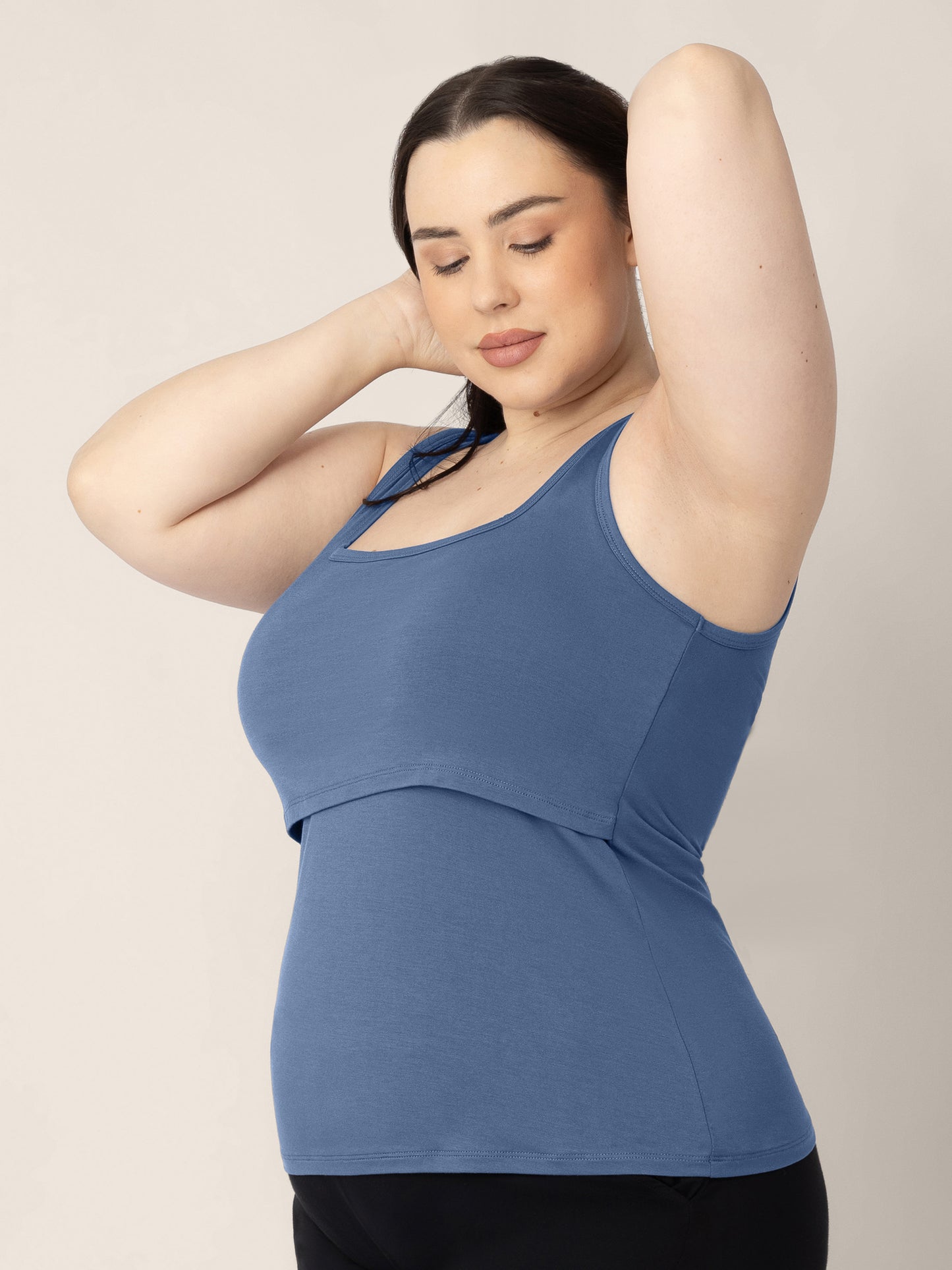 Three quarters view of a model wearing the Everyday Essential Nursing Tank in Slate Blue 