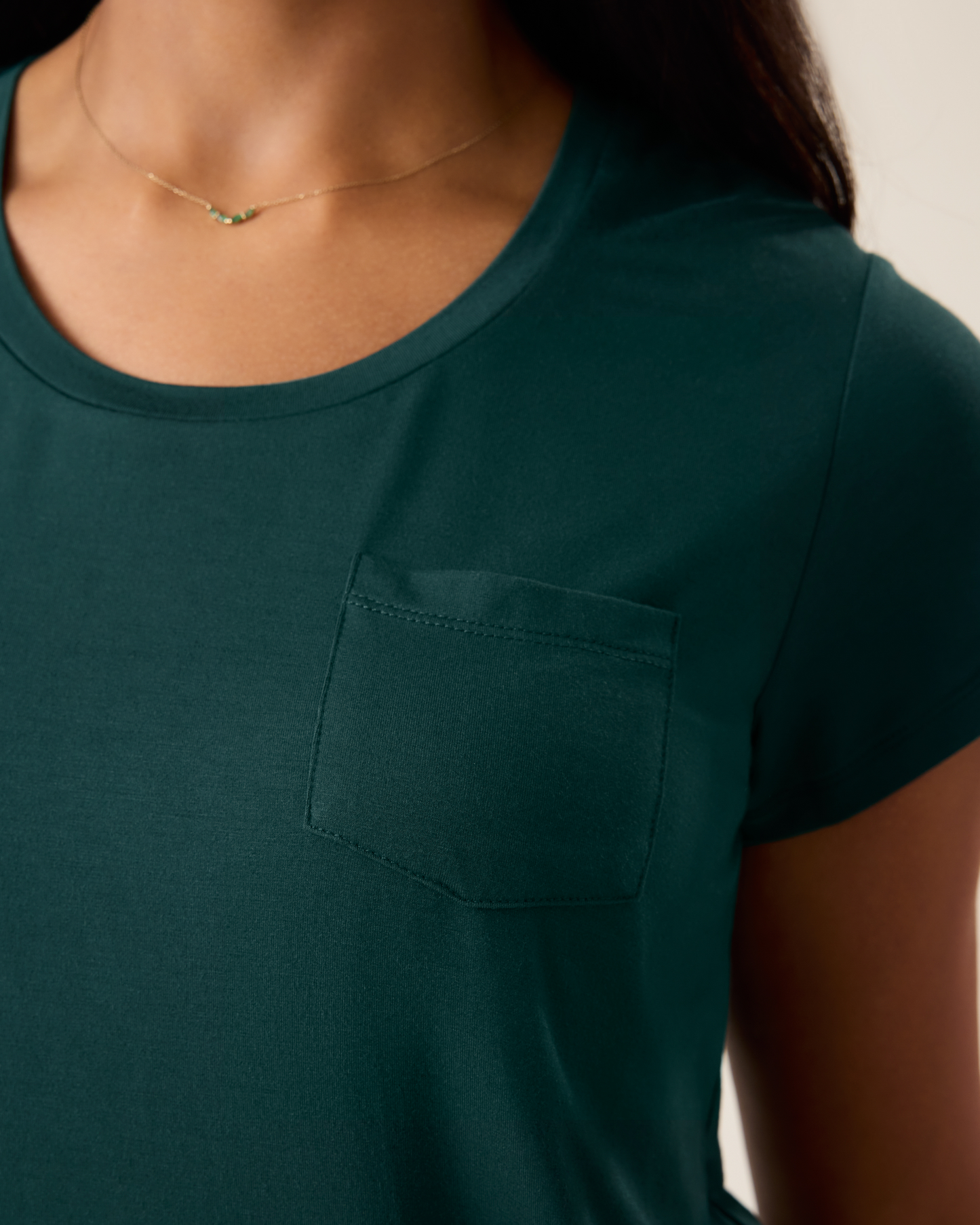 Woman wearing the Everyday Maternity & Nursing T-shirt in Evergreen, showing neckline and pocket