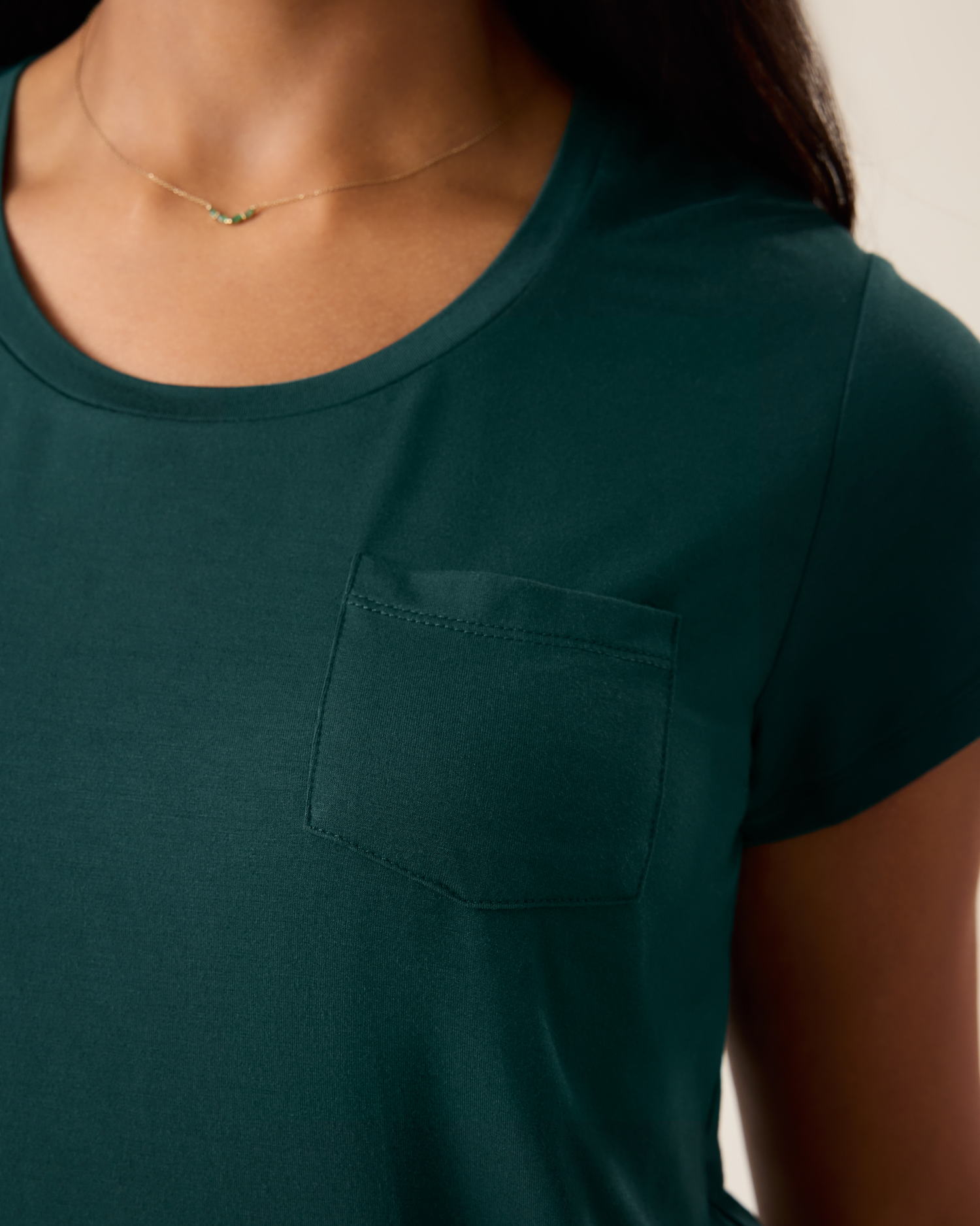 Woman wearing the Everyday Maternity & Nursing T-shirt in Evergreen, showing neckline and pocket