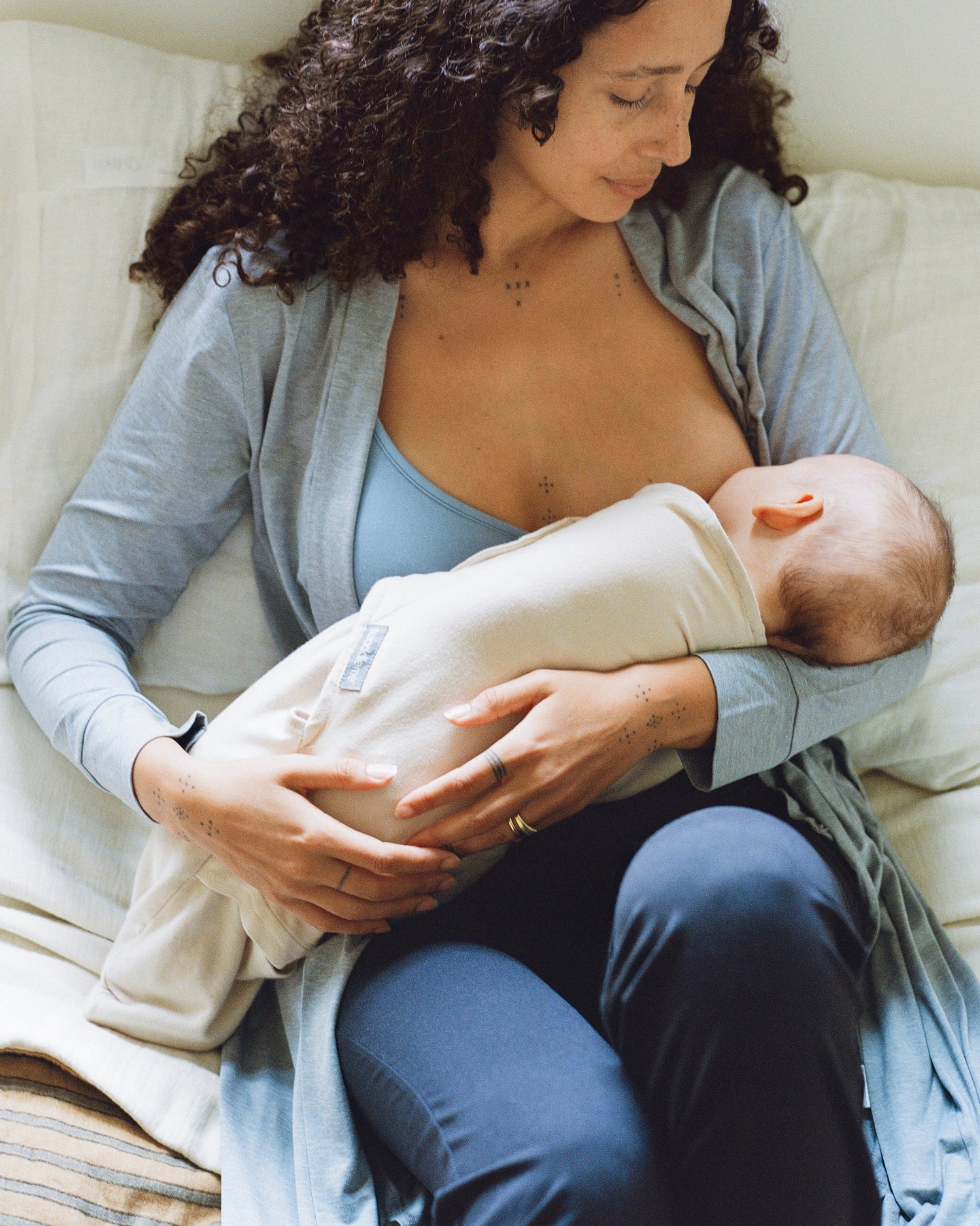 Model wearing French Terry Maternity & Nursing Bralette in Vintage Blue nursing a baby@model_info:Natasha is wearing a Medium.