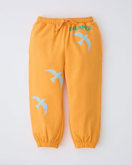 French Terry Jogger in Orange Bird on a gray background.