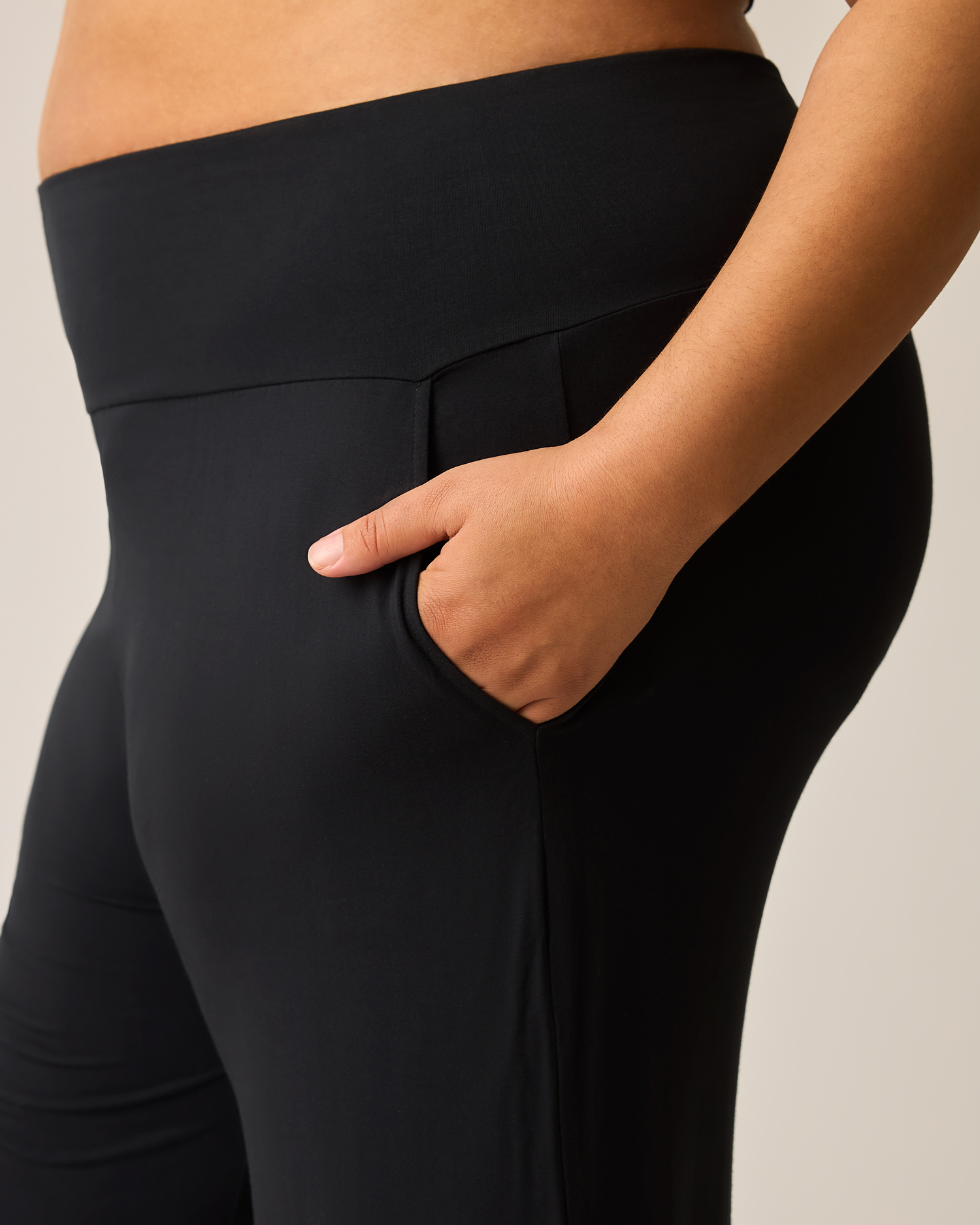 Woman wearing the Bamboo Wide Leg Maternity & Postpartum Lounge Pant in black showing waistband and pocket detail