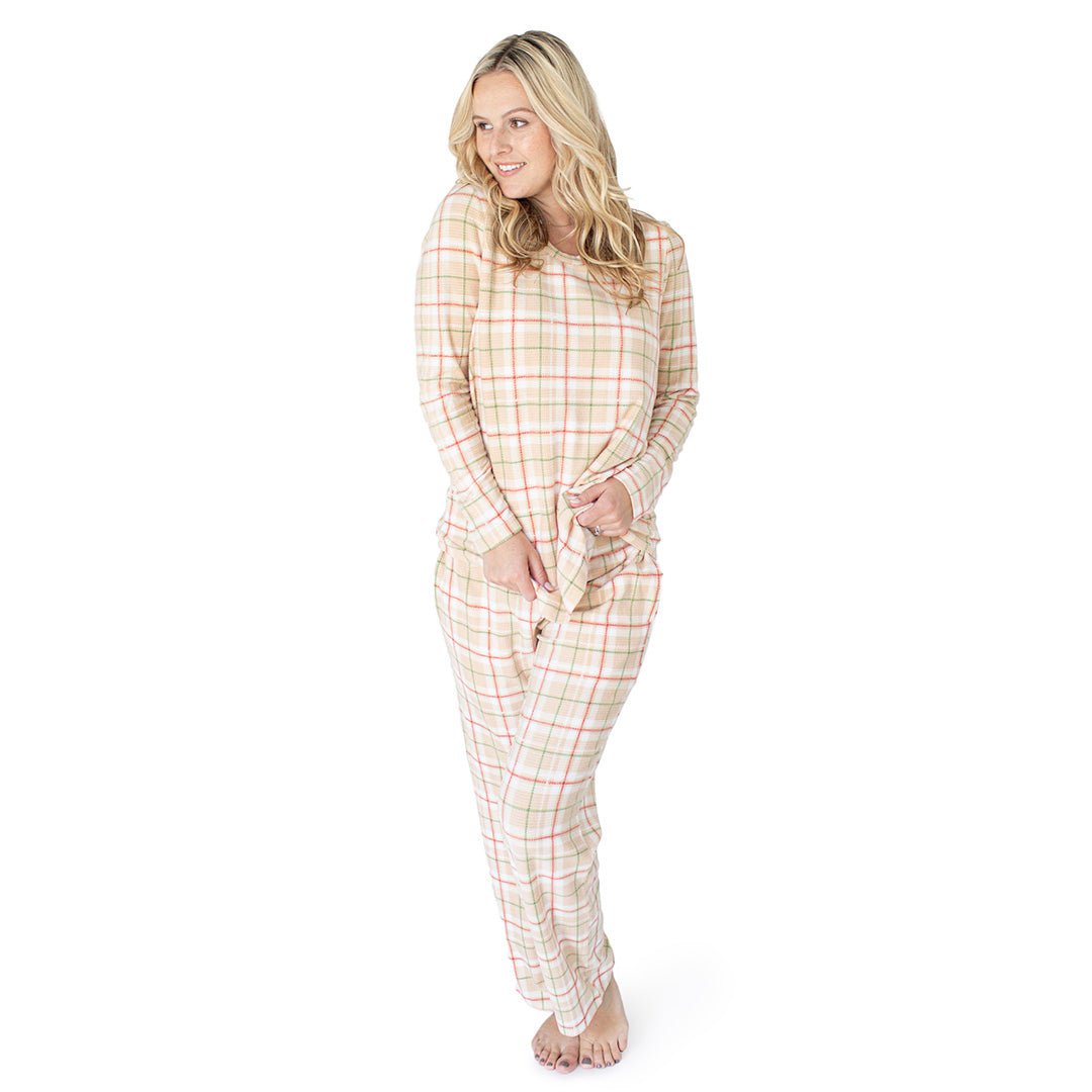 Model wearing the Fleece Nursing & Maternity Pajama Set in Plaid with her hands on her front. @model_info:Maddy is wearing a Small.