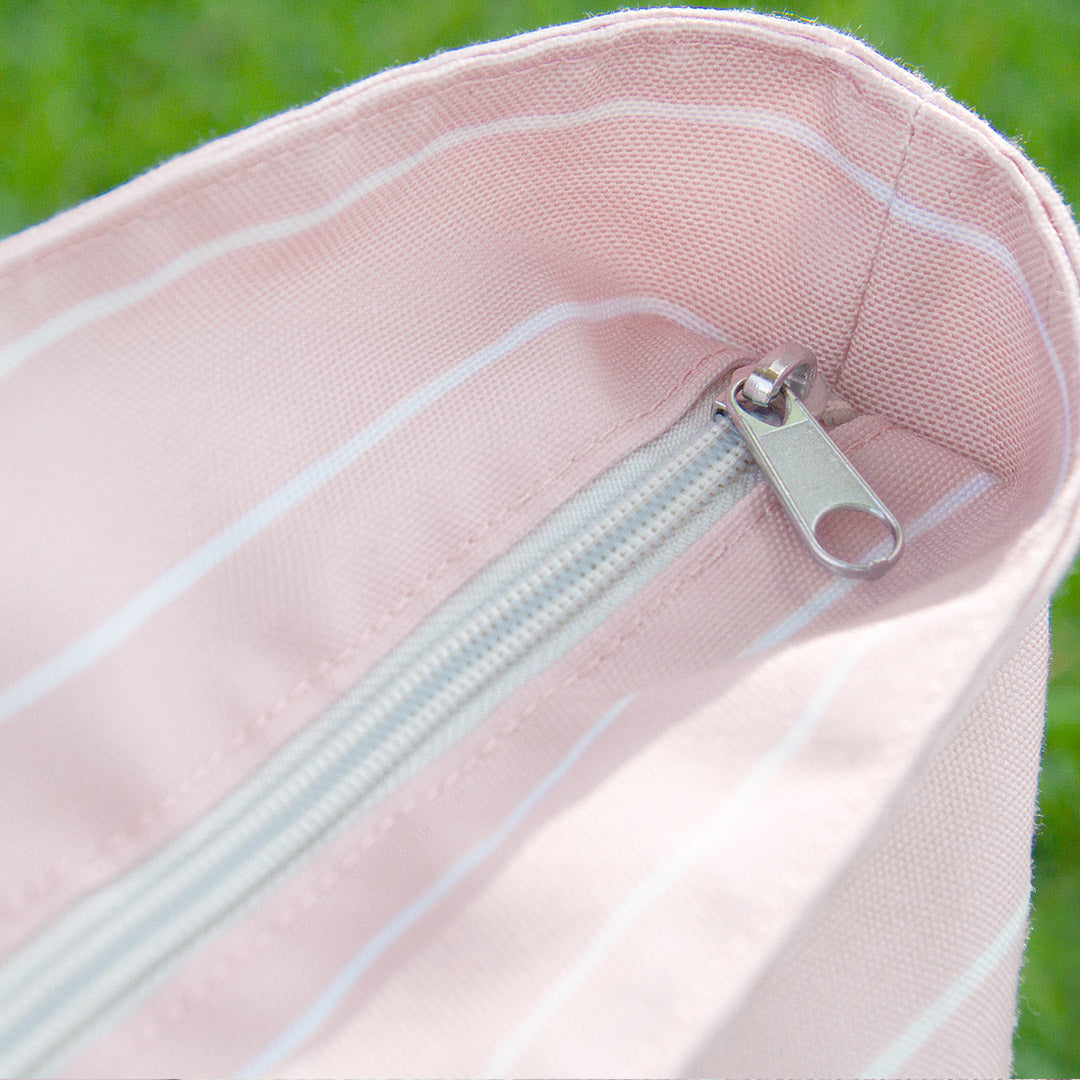 Closeup of the zipper on the Florence Tote in Pink & White Stripe