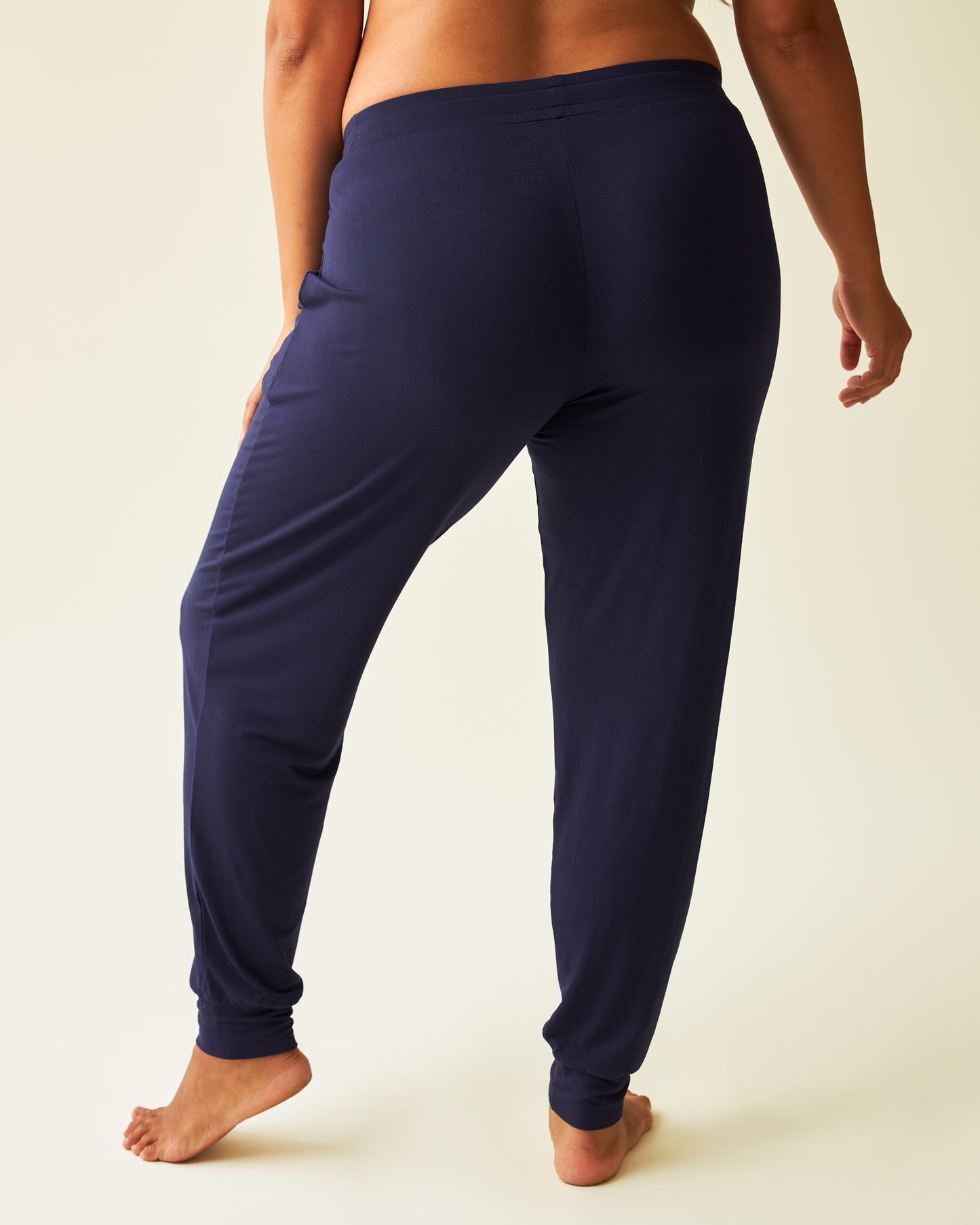 Back view of pregnant model wearing the Everyday Lounge Jogger in Navy