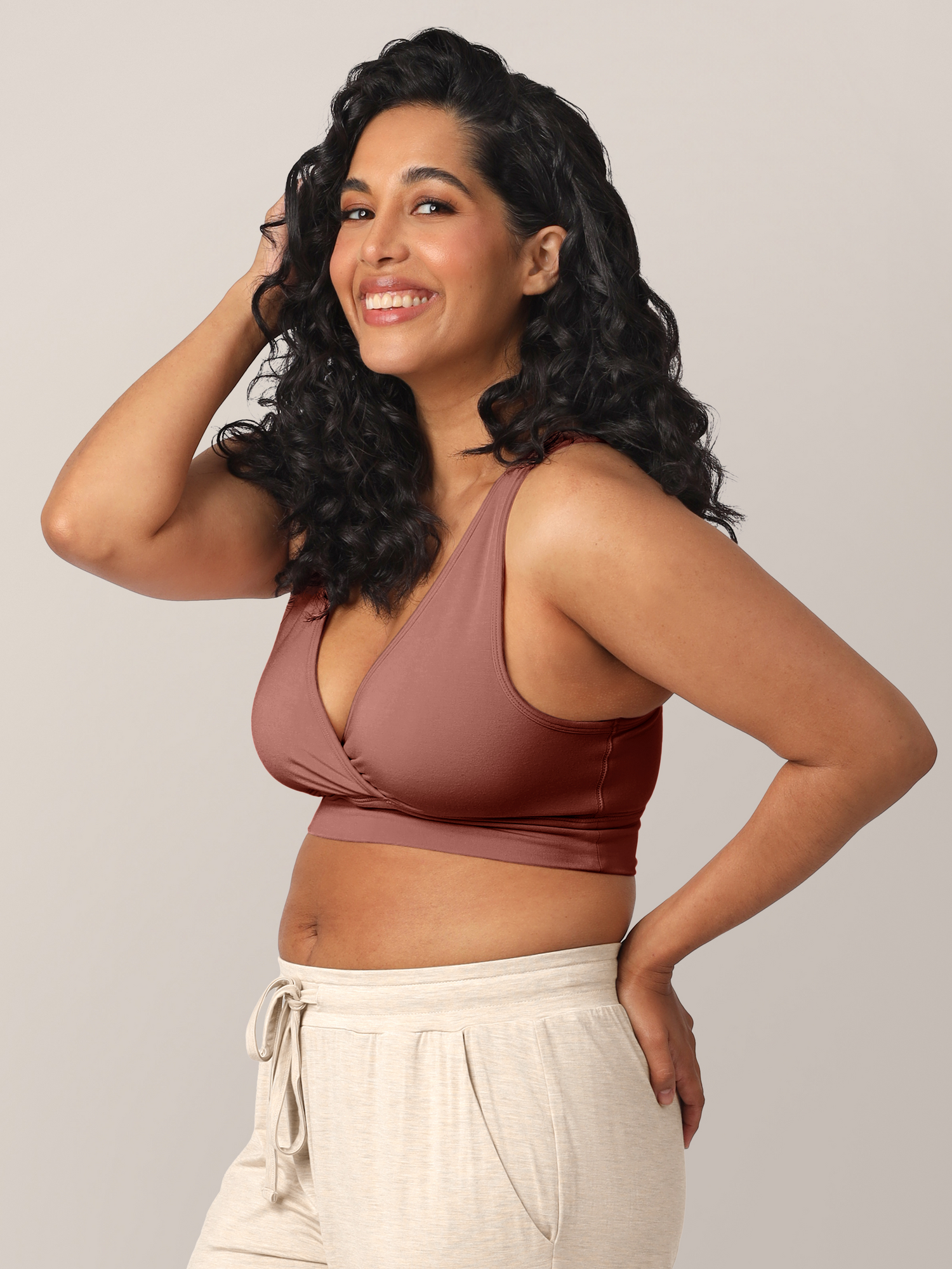 Side view of Model wearing the French Terry Nursing Bra in Redwood.