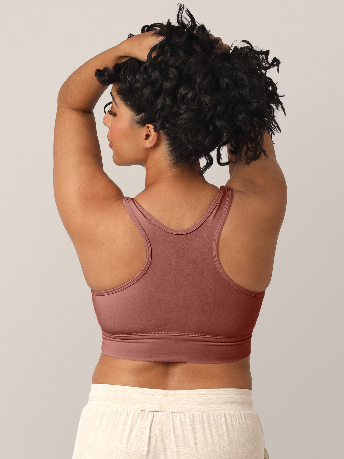 Back view of a model wearing the French Terry Racerback Nursing & Sleep Bra in Redwood