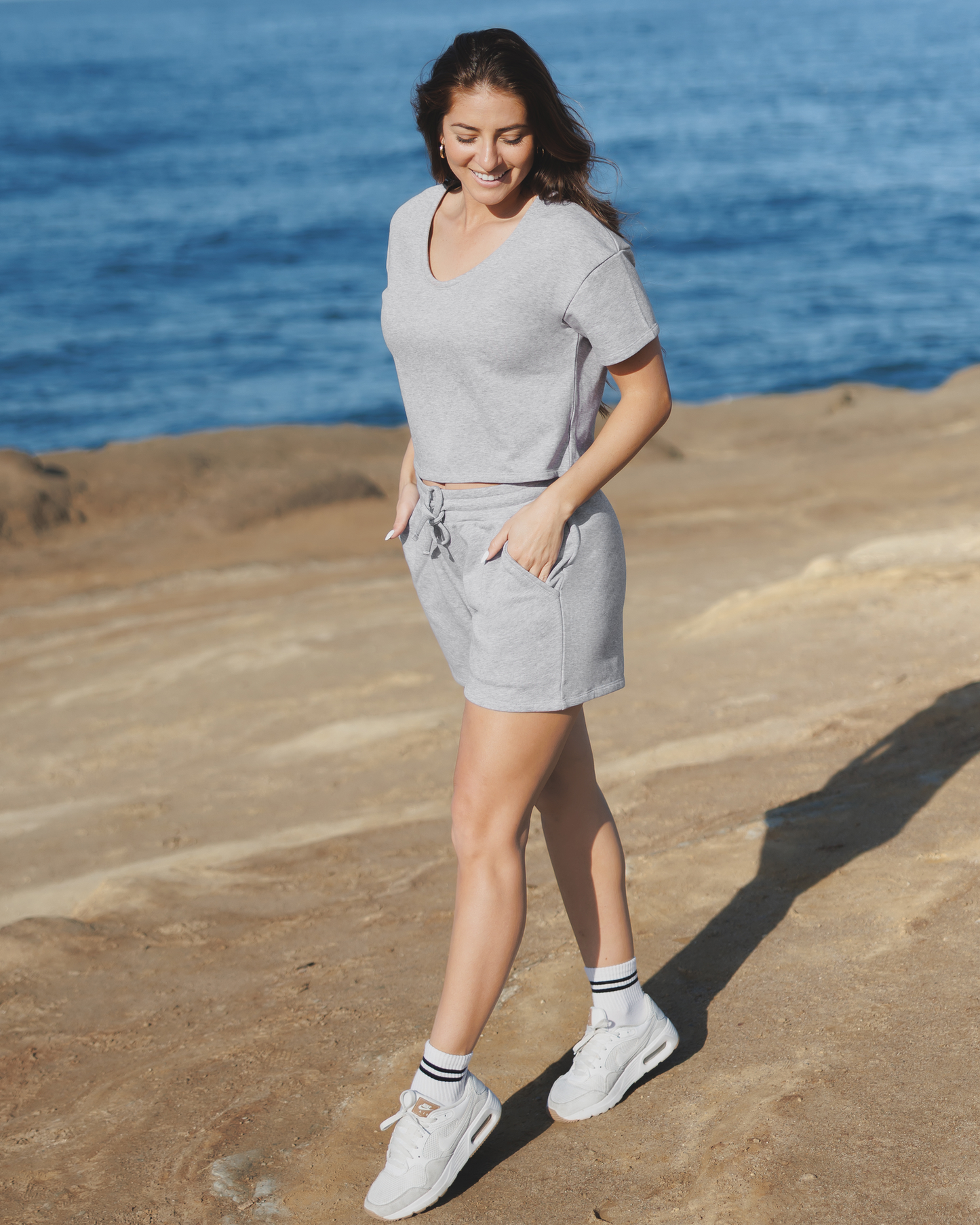 Close up of model wearing the French Terry On the Go Short in Grey Heather, paired with matching French Terry Nursing T-shirt