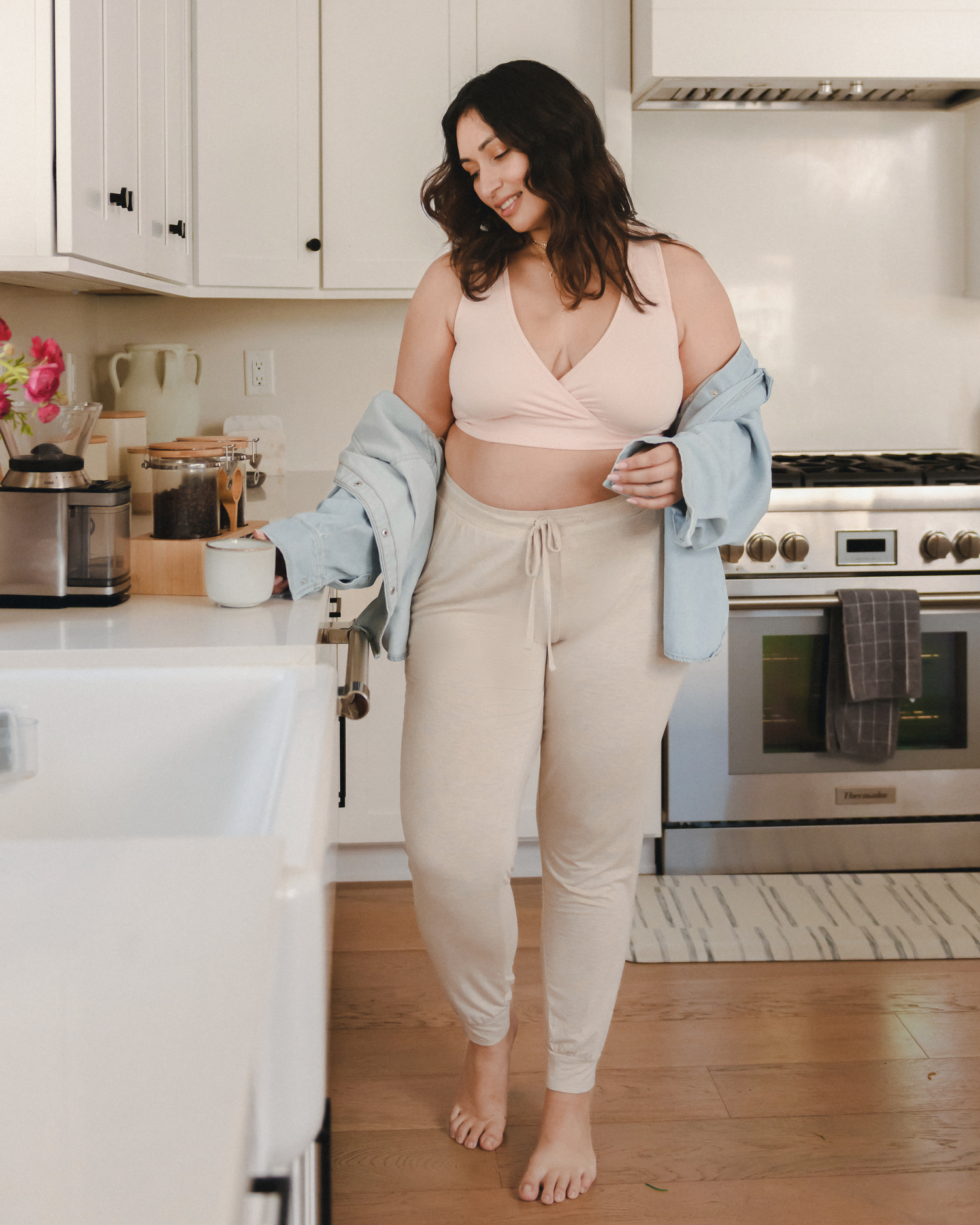 Model drinking coffee while wearing the French Terry Racerback Nursing & Sleep Bra in in Soft Pink @model_info:Connie is wearing an X-Large Busty.