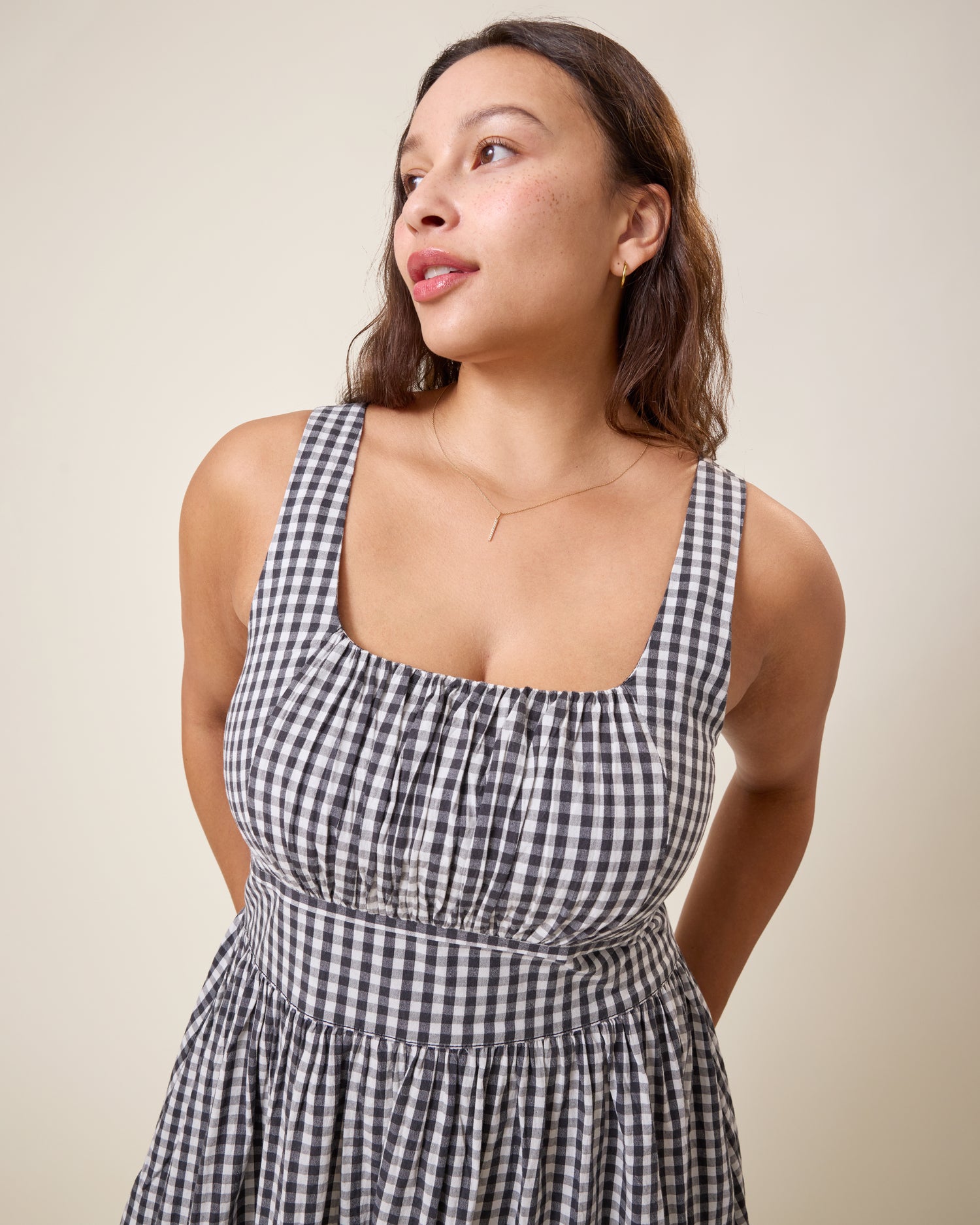 Front view of model wearing Gracie Poplin Nursing Midi Dress in Black & White Gingham on a neutral background