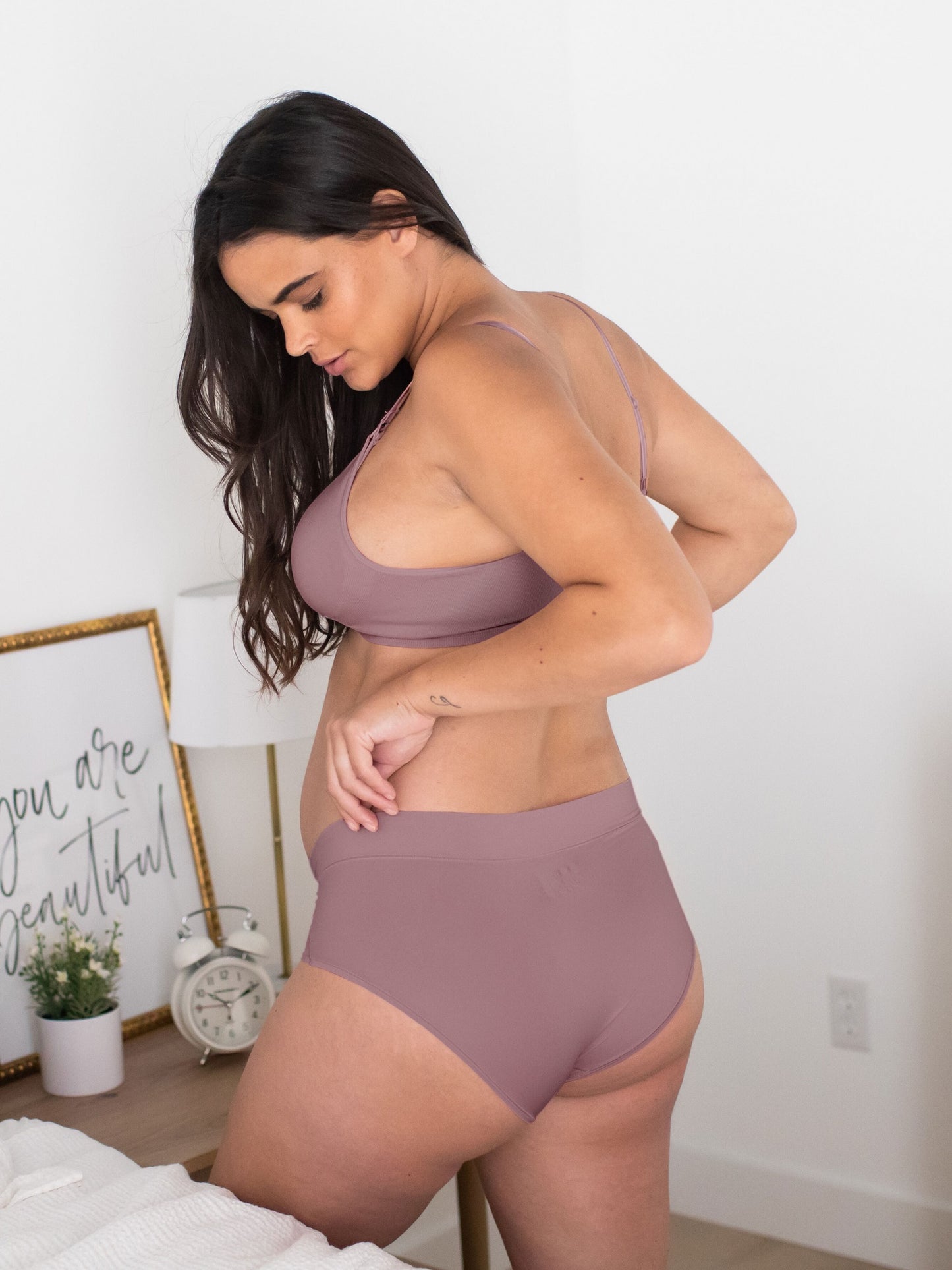 Pregnant model wearing the Grow with Me™ Maternity & Postpartum Brief in Twilight