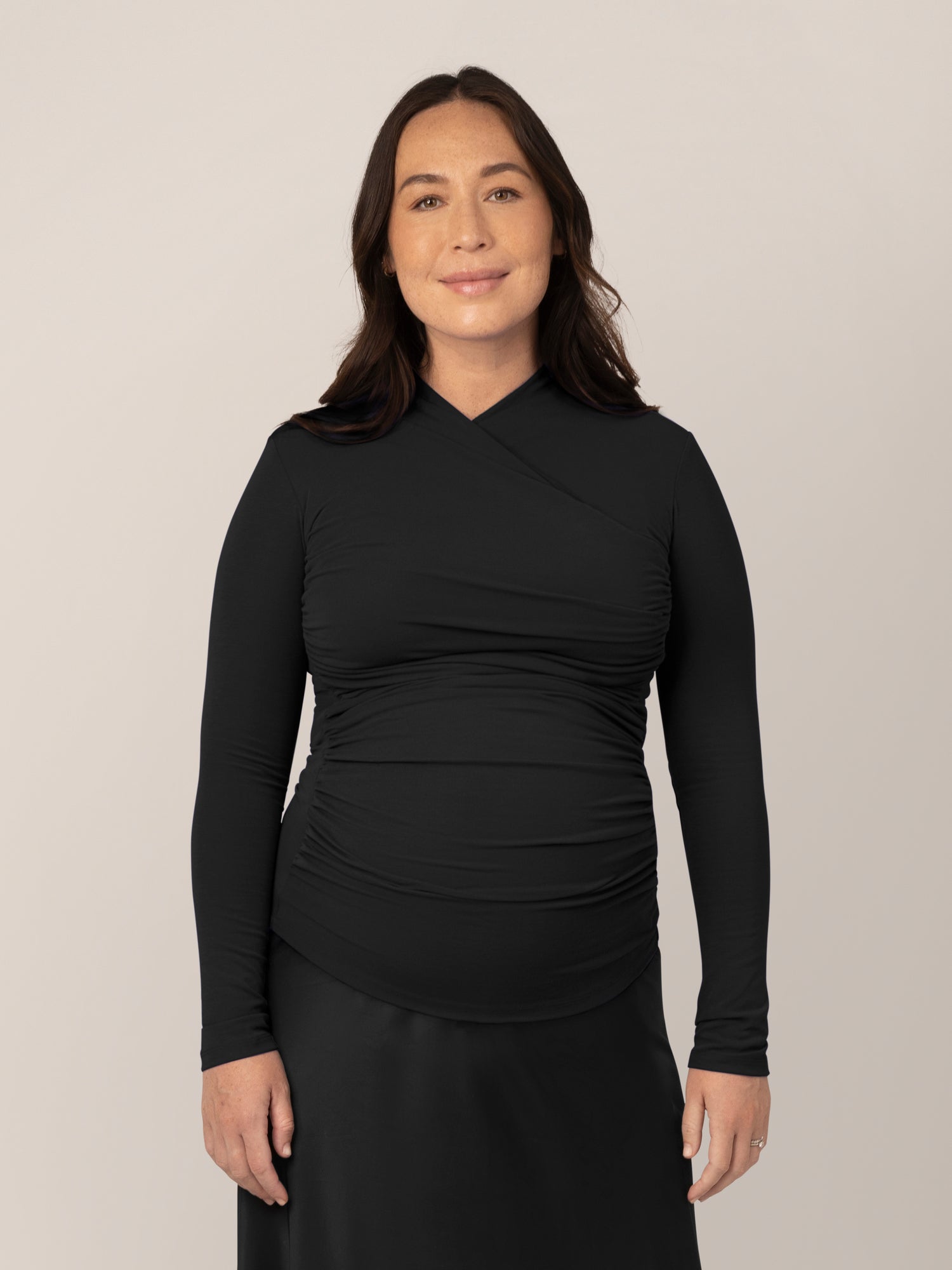 Front view of model wearing the Gianna Shirred Maternity & Nursing Top in Black@model_info:Susanna is wearing a Small.
