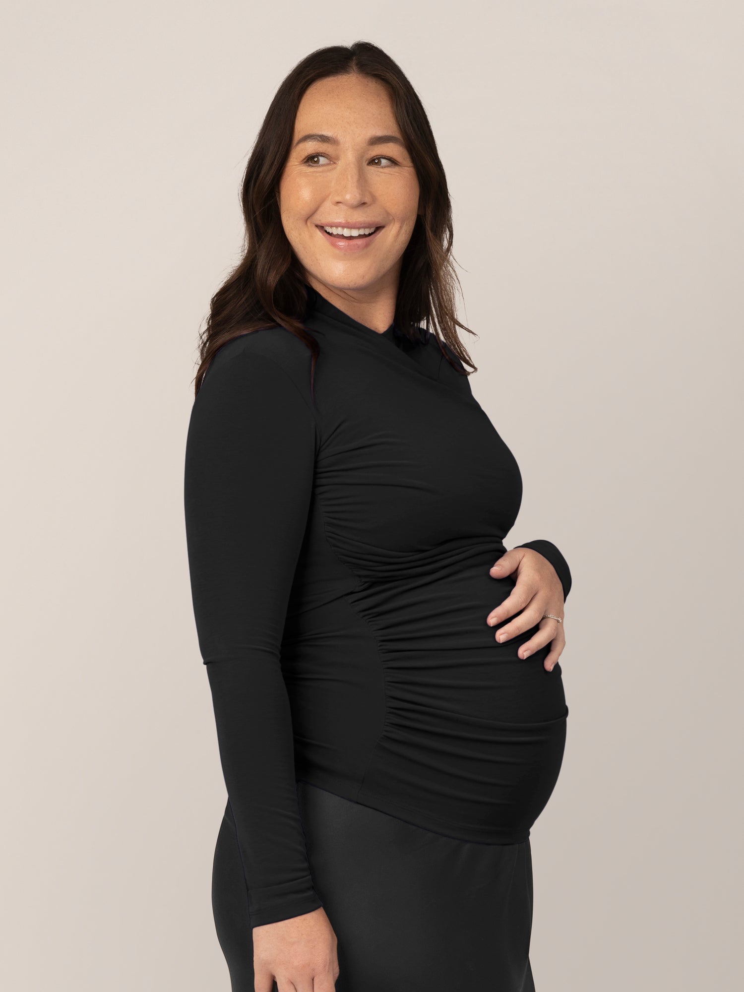 Side view of model wearing the Gianna Shirred Maternity & Nursing Top in Black